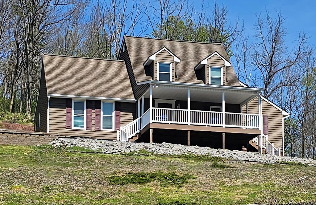 VERY NICE CAPE COD STYLE HOME OFFERING BEAUTIFUL VIEWS, BACKYARD PRIVACY, CONVENIENT LOCATION AND MANY RECENT IMPROVEMENTS! THIS 3 BR, 2 BA HOME HAS WARM AND COZY WRITTEN ALL OVER IT THANKS TO THE CURRENT OWNERS VISION. THE LARGE COVERED FRONT PORCH IS WHERE YOU'LL ENJOY THOSE MOUNTIAN VIEWS. THE HOME IS SITUATED ON 1.70 ACRES. THE MOST RECENT IMPROVEMENTS INCLUDE, NEW FLOORS THROUGHOUT, NEW KITCHEN CABINETS, NEW BACKSPLASH, NEW UPPER-LEVEL BATHROOM REMODEL, NEW STAIR BANISTER AND RAILING, SOME FRESH PAINT AND NEWLY PAVED DRIVEWAY. THERE'S A LARGE EAT IN KITCHEN, FORMAL DINING ROOM, SPACIOUS LIVING ROOM WITH A WOOD BURNING FIREPLACE, AND A QUAINT READING NOOK. THE PRIMARY BEDROOM AND ENSUITE BATH IS ON THE MAIN LEVEL, AS WELL AS A ROOM THAT CAN BE USED AS AN OFFICE OR PLAYROOM. THAT SAME ROOM HAS A LOFT FOR STORAGE. THE UPPER LEVEL HAS THE NEWLY REMODELED BATHROOM AND 2 LARGE BEDROOMS. THERE'S PLENTY OF EXTRA STORAGE THROUGHOUT THE HOME. THE CURRENT OWNERS HAVE TAKEN CARE OF MOST EVERYTHING FOR YOU! SO, START PACKING!