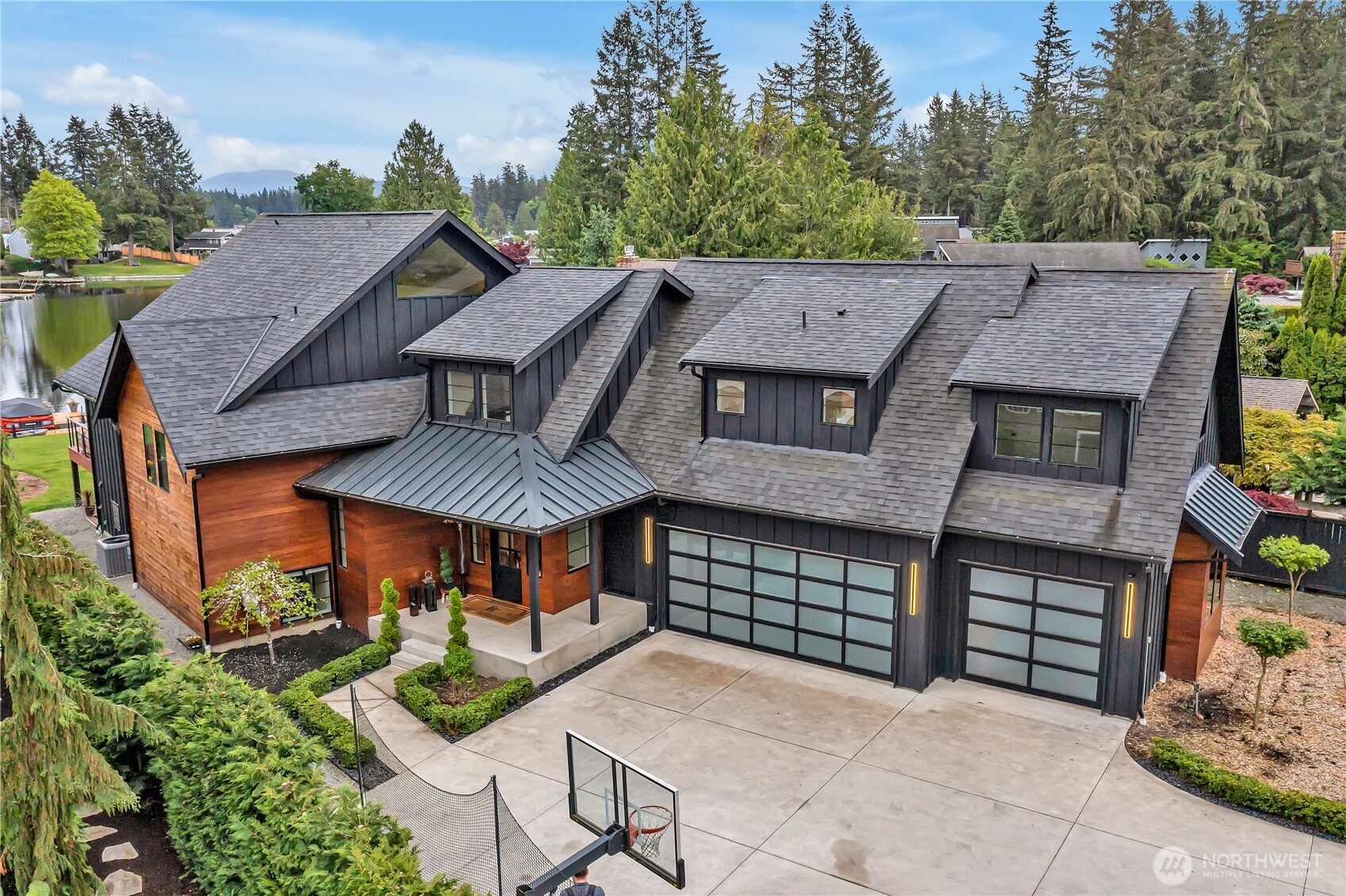 Luxury lakefront home with panoramic water and mountain views from your private deck. Gated entry with water rights—no costs to maintain the lush lawn. Features New Carpet & New Paint, campfire pit, built-in trundle bed in bunk/rm sleeping 6, and central AC for year-round comfort. Wired for generator, quiet mornings for fishing, afternoons for jet skiing and boating, and tranquil evenings on the deck. Vacation quality at home, Located in a peaceful, active Lake Sawyer community. Custom-built 2021 with over 4,000sqft, designed for large gatherings, including a chef’s kitchen with sky ceilings, grand great room, oversized entertainment pantry, and a bonus room on the lower level. Five bedrooms, 3.5 baths, all on a private. 593acre-lot.