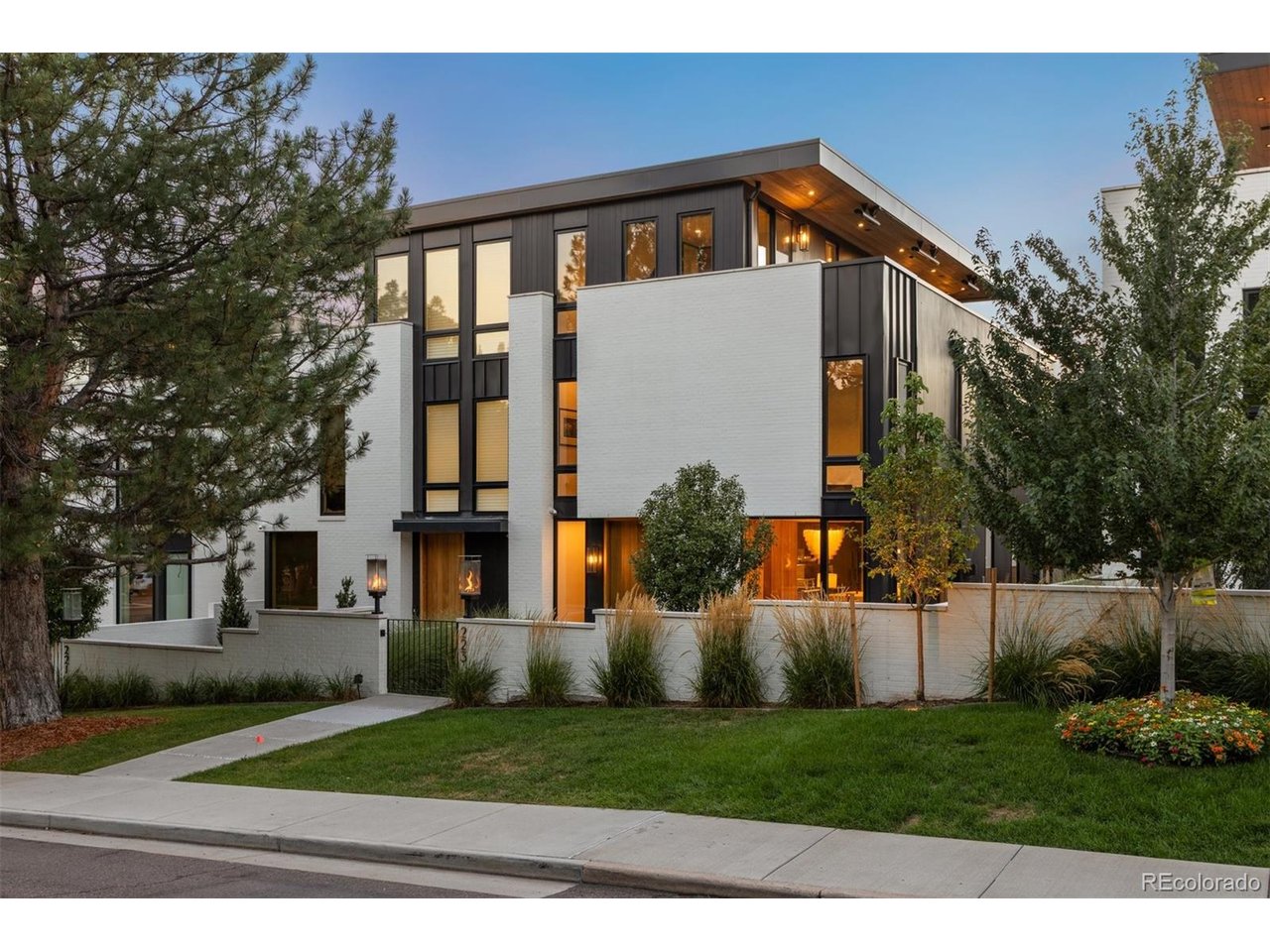 223 Garfield Street is the epitome of modern luxury in the heart of Cherry Creek, one of Denver's most prestigious and sought-after neighborhoods. Designed by award-winning Alvarez Morris Architecture Studio, built by Henry Homes, and appointed with custom furnishings by Studio M Design, this exceptional residence seamlessly blends architectural sophistication, impeccable craftsmanship, and effortless livability.Designed to maximize privacy, natural light, and seamless indoor-outdoor living, the home features three distinct outdoor entertaining spaces thoughtfully integrated throughout. At the heart of the residence, the main level is an entertainer's dream, with an exceptional open-concept floor plan framed by warm wood accents, luxurious quartz surfaces, designer lighting throughout, and two sets of expansive stacking doors that completely open the interiors to the outdoors.Every detail has been thoughtfully curated - from the striking designer hanging seat and custom-designed dining room, an architecturally integrated custom glass-enclosed wine room, to a versatile third-level bonus space offering the ideal setting for a home gym, office, or additional retreat. A discreetly hidden elevator provides effortless access to all four levels, while a fully automated Savant system with custom Lutron shades brings sophisticated technology and convenience throughout the home. Top-of-the-line appliances and finishes further underscore the exceptional quality and craftsmanship.Crowning the residence, the top-level deck captures sweeping Rocky Mountain views and offers an exceptional setting for outdoor entertaining. All of this is just moments from the world-class shopping, dining, and amenities of Cherry Creek, with the best of the neighborhood within walking distance.Sophisticated yet inviting, architectural yet warm, 223 Garfield Street offers a rare expression of contemporary Colorado living in the heart of Cherry Creek.