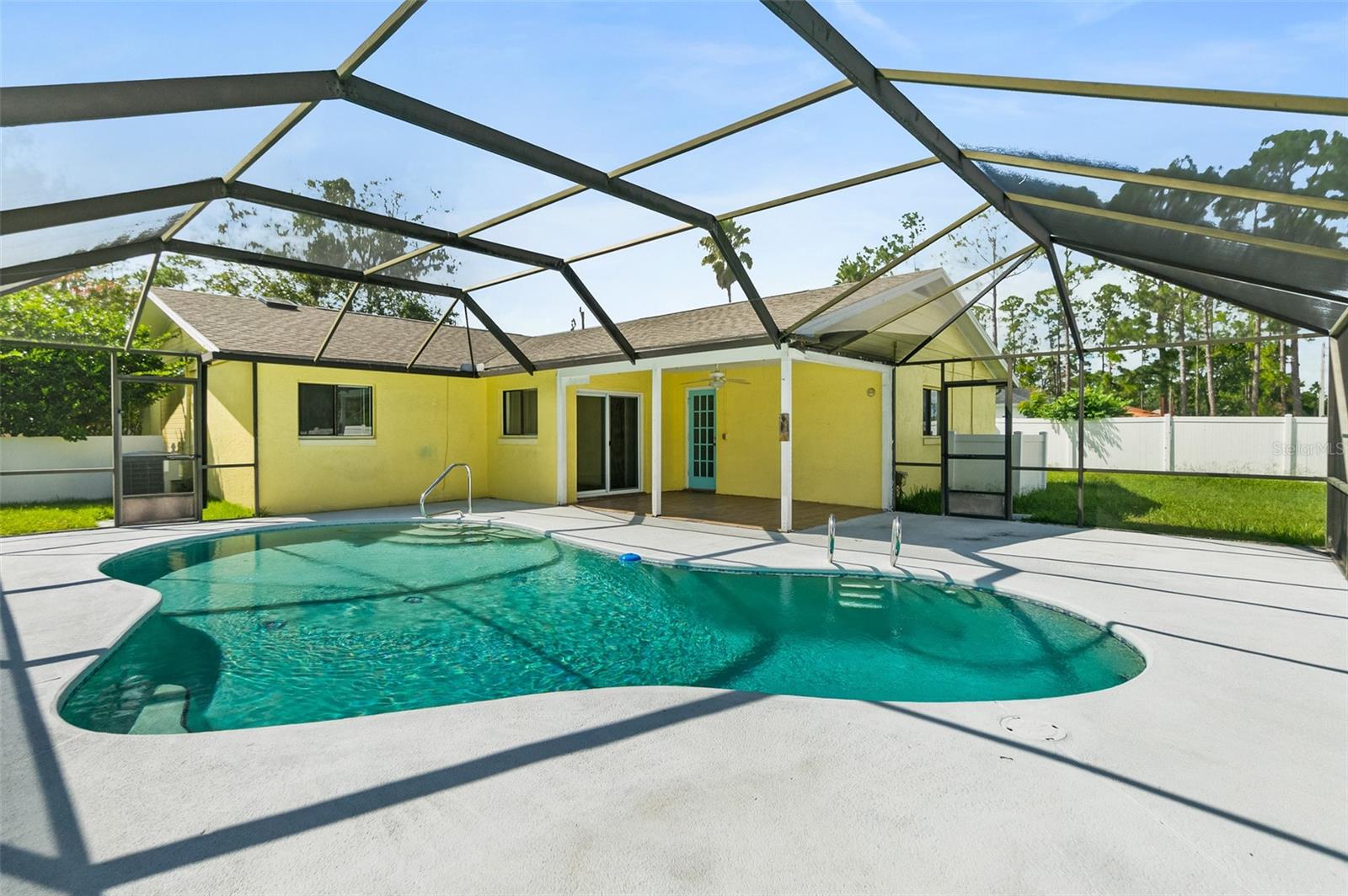 Virtually Staged. Updated cinder block POOL home in Palm Coast with no HOA. Features new luxury vinyl plank flooring and fresh interior paint throughout. The open-concept kitchen includes a breakfast bar overlooking the living area. The primary bedroom offers a large walk-in closet, ceiling fan, and private access to the screened lanai and pool. Bathrooms feature high ceilings and skylights. The screened pool is approximately 7 feet deep, and the large pool patio provides space for a BBQ and outdoor seating. The property also includes a spacious, fully fenced backyard with a producing lemon tree. Roof replaced in 2022, water heater in 2019, HVAC in 2016, and newer vinyl fence. No HOA, NO CDDs and NO rental restrictions! LOCATION! LOCATION! Enjoy exceptional convenience with Publix, Target, TJ Maxx, Palm Coast Landing, restaurants, shopping, and Epic Theatres just minutes away. Seminole Woods Park, schools, the library, walking and biking trails, pharmacies, and medical facilities are also nearby. AdventHealth Palm Coast is approximately six minutes away, I-95 is easily accessible, and Flagler Beach is only about 10–15 minutes from the home. Palm Coast is a paradise for outdoor enthusiasts, where you can enjoy over 19 miles of uncrowded coastline, 125 miles of hiking and biking trails, 15+beautiful parks, world-class golfing and tennis facilities, as well as excellent fishing and boating opportunities. With your own private pool and everything Palm Coast has to offer within easy reach, this could be the home you have been waiting for.