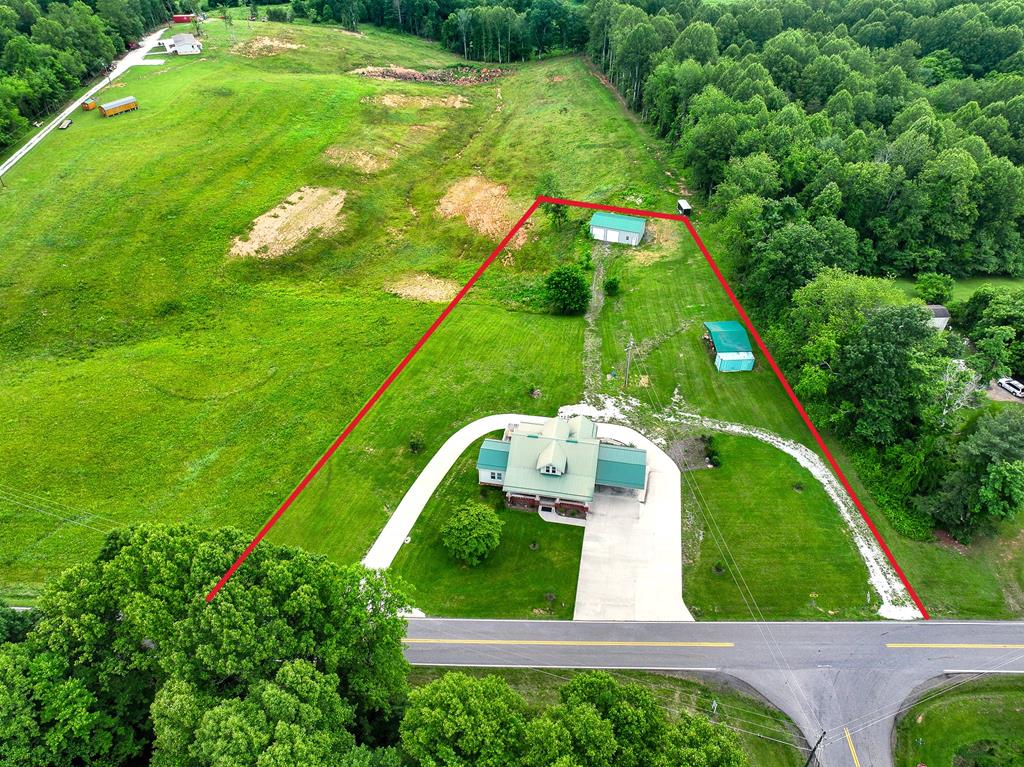 Gorgeous Restored 1927 Farmhouse nestled on 2 +/- acres at the base of the Blue Ridge Mountains! This home has been completely remodeled down to the studs with new insulation, drywall, hvac, windows, flooring, lighting, kitchen, baths...EVERYTHING NEW including the 3 bedroom septic system and well! This modern makeover also includes a 16' X 18' room addition and a 2 car carport addition as well as a 24' X 40' metal garage building. Other upgrades include a circle concrete driveway and a Ford electric car charger. You'll love the large covered front porch and the expansive back deck- perfect for entertaining or enjoying your morning coffee. Shown by appointment only. New Survey pending. Seller used loft as 3rd Bedroom.