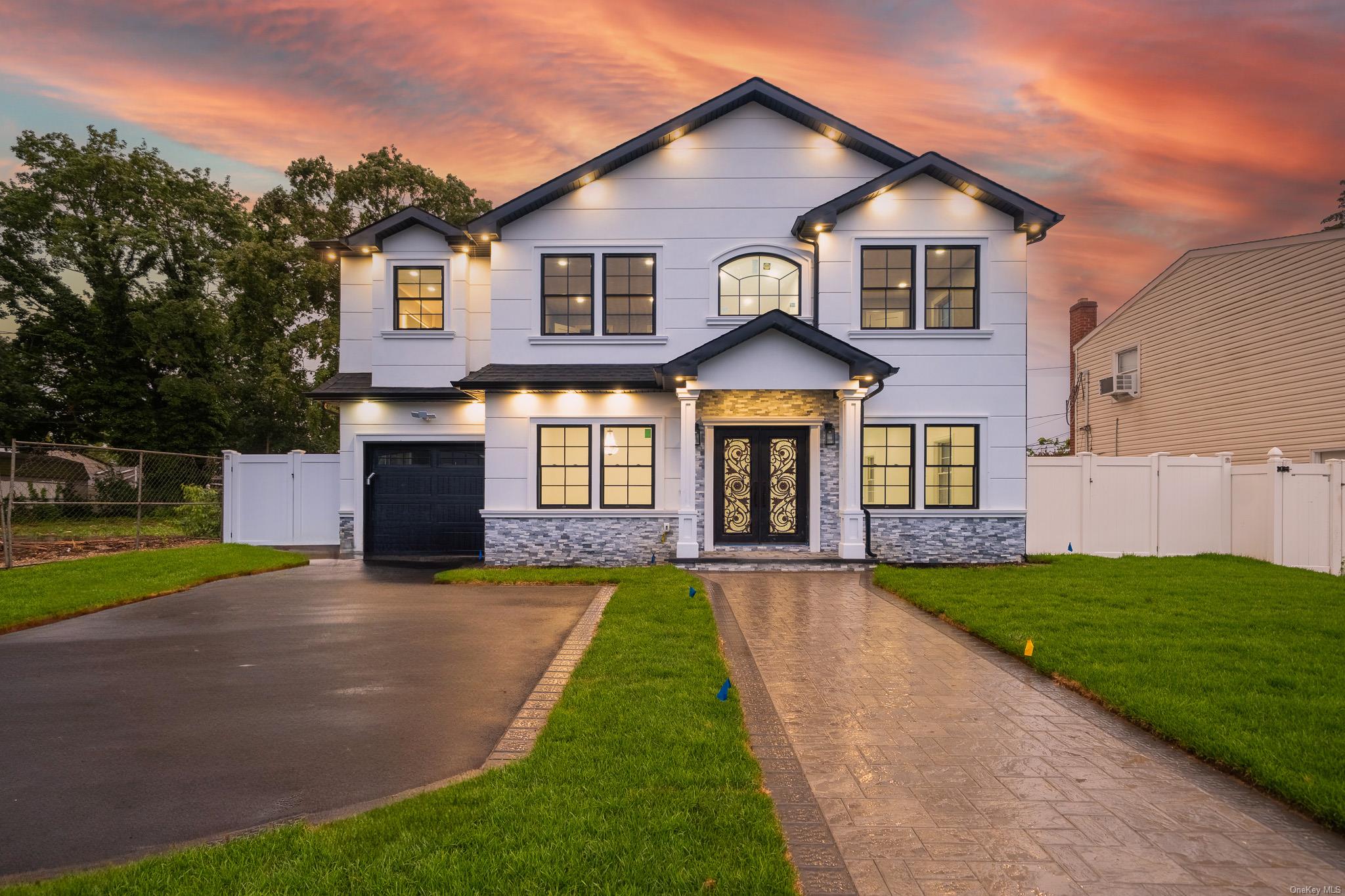 Welcome to Your Dream Home in the Heart of Bethpage! Step into luxury living with this brand-new, exquisitely designed residence featuring 5 spacious bedrooms and 4.5 modern bathrooms. Crafted for comfort and elegance, the home boasts an open-concept layout ideal for both everyday living and entertaining. The gourmet kitchen is a chef’s dream, showcasing high-end finishes, custom cabinetry, and premium appliances. Rich hardwood flooring graces the bedrooms, while durable tile spans the entire main floor. The inviting electric fireplace, custom moldings, and quality finishes throughout reflect true attention to detail. Designed for versatility, the first floor features guest quarters with a full bath, perfect for extended family or visitors, along with a separate living room, dining area, family room, and a stylish half bath. The second floor offers 4 generously sized bedrooms and 3 full baths, including a luxurious master suite. Additional highlights include Pella windows, stucco and siding exterior, and a prime location just one mile from the LIRR and close to all local amenities. This home truly offers all the bells and whistles for modern living. Don’t miss this exceptional opportunity to own a turn-key property in one of Bethpage’s most desirable neighborhoods.