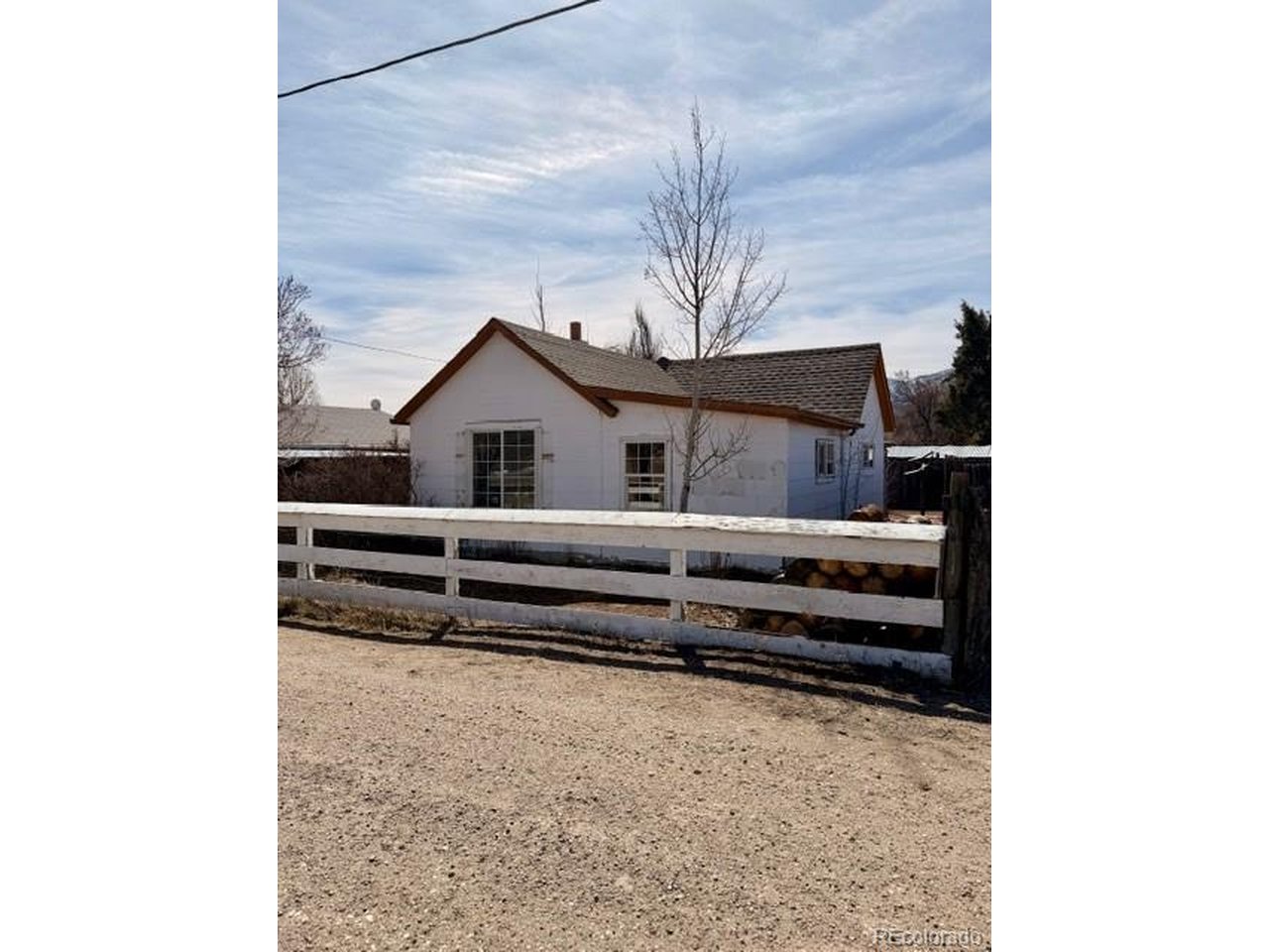 Affordable living in Salida! .21 acre property in Historic Smelter Town, just minutes from downtown Salida. Cottage currently in the process of being remodeled with potential for a 2 bed, 1 bath layout. New roof soffit and fascia installed. Great opportunity for a handy buyer or fix-and-flip investor. Property includes a two car garage with wood- burning stove, hoop house, quonset hut, and original cabin style shed. Country-like setting with the convenience of walking or biking distance to Salida shops, dining nad recreation. Plenty of potential to finish and make it your own.
