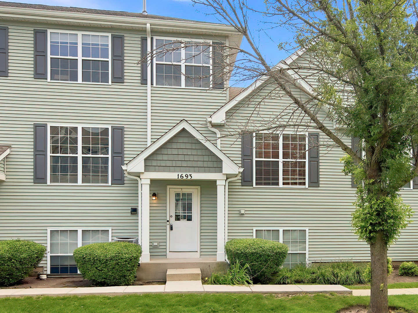 Welcome to this bright, well kept townhome in the Heron Bay neighborhood, in the highly rated Big Hollow school district with Grant Community High School. The front door opens to a landscaped courtyard where deer and wildlife wander through, and since it faces west, you get the sunset from the entry and the living room windows every evening. The kitchen catches the morning sun on the other side of the home. The main floor is open, with tall ceilings in the living room and a kitchen made for real cooking: an island, tall cabinets, stainless appliances, and space for a table. A deck off the kitchen handles grilling and morning coffee. Durable vinyl plank flooring runs throughout, with a half bath on the main level for guests. Both bedrooms are upstairs. The primary has a walk-in closet and a private full bath with double sinks. The second bedroom has its own full bath just outside the door. The walk-in basement adds a finished bonus room for an office, gym, or family space, with washer and dryer hookups ready to go. Mechanical systems are newer. Attached 2 car garage.