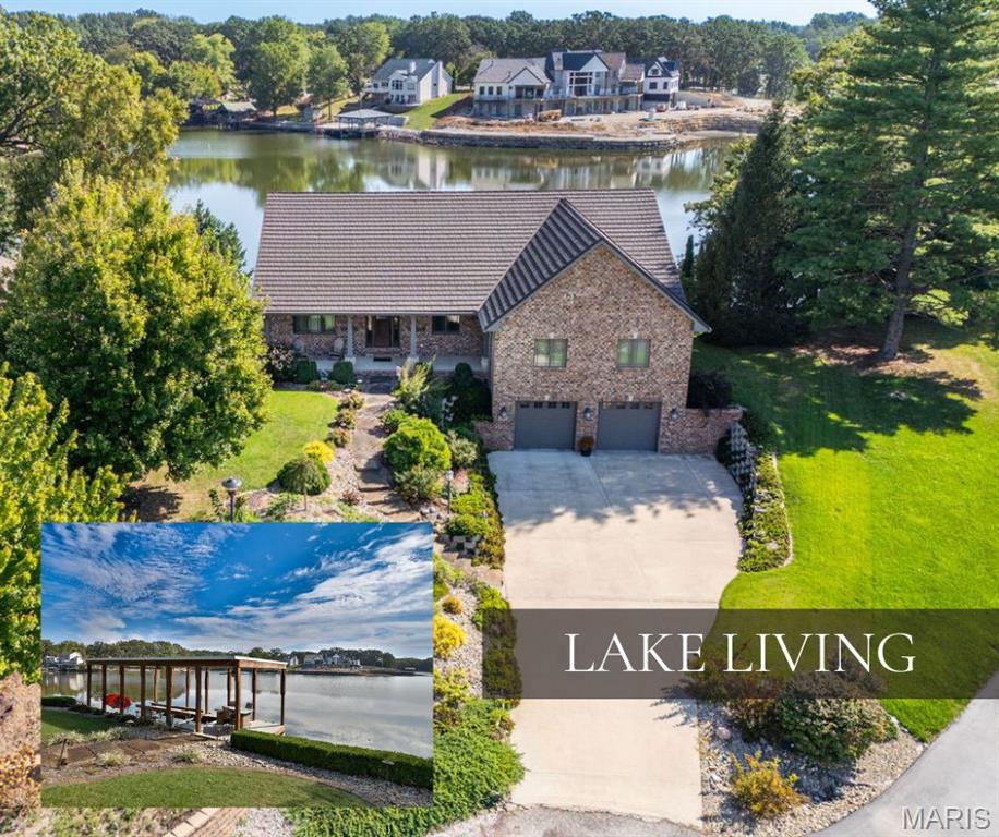 Lakeside Luxury Living
Where architecture, scenery, and thoughtful design converge — this lakefront retreat is a masterpiece of craftsmanship and comfort. With six spacious bedrooms and four baths, the home offers flexibility for every lifestyle. If you don’t need all six, one of the upper bedrooms now serves beautifully as a home office adjoining the primary suite, while a lower-level bedroom functions perfectly as a home gym.
Inside, you’ll find an open floor plan with soaring vaulted ceilings, hardwood flooring, and plaster coated walls — all enhanced by panoramic views of the main lake from nearly every room. The chef’s kitchen is truly remarkable, offering Wolf appliances, Sub-Zero refrigeration, granite countertops, a prep sink, steamer, beverage cooler, and ice maker — all surrounded by extensive custom cabinetry and built-in storage throughout.
The primary suite is a true retreat, complete with a deep whirlpool tub and steam shower for the ultimate spa experience. Upstairs bedrooms feature double closets, offering generous storage and functionality.
On the walkout lower level, you’ll find a cozy fireplace in the family room, a home theatre with 120” screen, and two versatile bonus areas perfect for recreation, work, or hobbies. Large windows frame the serene lake views, creating an inviting space for relaxation or entertaining.
Step outside and discover your private oasis — a beautifully landscaped yard leading to 150 feet of pristine lake frontage, a covered dock with boat lift, fenced rear lawn, and convenient access to the beach, pickleball, tennis courts, and playground. Whether hosting family and friends or enjoying a quiet evening by the water, this property redefines lakefront living.