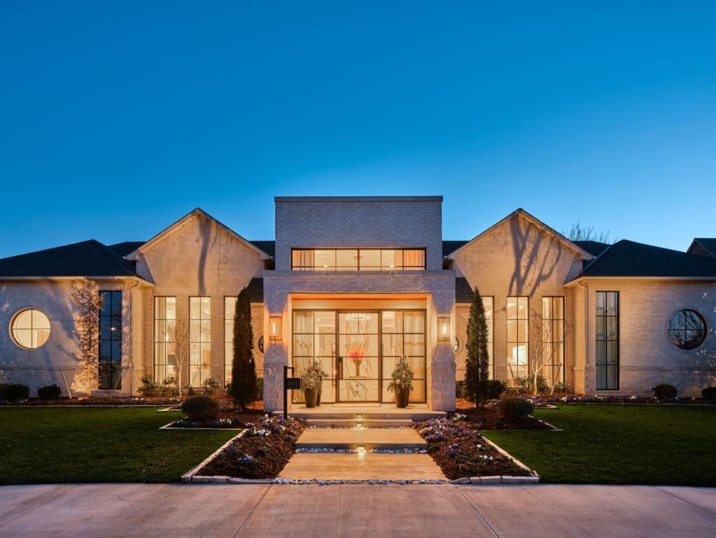 Spanning 8,649 square feet — all on a single level — this home delivers the scale of an estate with the effortless flow of a modern retreat. From the moment you step inside, it feels less like a house and more like a five-star hotel. Clean lines, inset baseboards, recessed vents, and top-of-the-line finishes reflect an uncompromising level of craftsmanship rarely found at this scale.The design is sleek and contemporary with transitional touches, striking the perfect balance between sophistication and comfort. Floor-to-ceiling windows frame the courtyard-style backyard, flooding the interior with natural light and creating seamless indoor-outdoor living throughout.The heart of the home is a showpiece kitchen designed for both everyday living and serious entertaining. An oversized quartz island anchors the space, complemented by a professional-grade six-burner gas range and an integrated Thermador refrigerator. A full-length butler’s pantry runs the entire span of the kitchen — complete with its own additional integrated Thermador fridge/freezer — offering incredible storage, prep space, and functionality without compromising the clean, streamlined aesthetic.The layout is as thoughtful as it is impressive. Five true bedrooms — each with its own ensuite bath and walk-in closet — provide privacy and comfort for everyone. An oversized executive office creates a quiet, dedicated workspace, and a fully equipped home gym brings wellness home.Outside, the resort-level experience continues.The zero-maintenance backyard features premium turf, a stunning pool with an expansive sun deck, a half basketball court, and an in-ground trampoline — designed for entertaining, play, and effortless enjoyment year-round.A six-car garage with a 10 person above-ground storm shelter completes the estate, delivering rare functionality to match the home’s scale and style.Single-story. Meticulously detailed. Truly exceptional.
