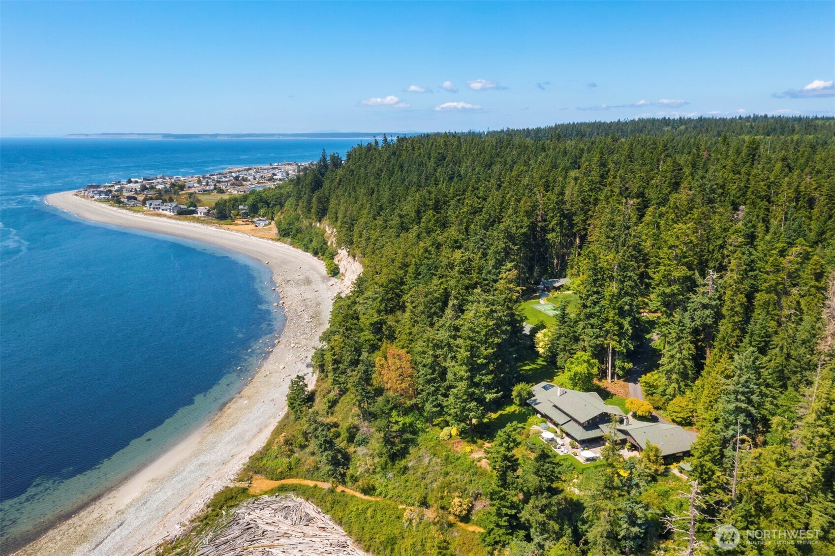 A truly exceptional 21-acre waterfront sanctuary, bordered by 16-acres of protected reserve. This island retreat lives like a private arboretum, offering unmatched privacy, natural beauty & sophistication. A meticulous remodel by Christian Grevstad has transformed the residence into a harmonious blend of timeless elegance and contemporary comfort. The property features four thoughtfully designed buildings, incl. a 5,214 sf primary residence, a 2,774 sf 'studio' building, 856 sf guest cottage & 413 sf cabin, for over ~9200 total sf. The grounds are equally remarkable w/ 246' of shoreline, pickleball court, walled garden, reflecting pool and sweeping western views of the Olympic Mts and Puget Sound. Visit virtual tours for additional content.