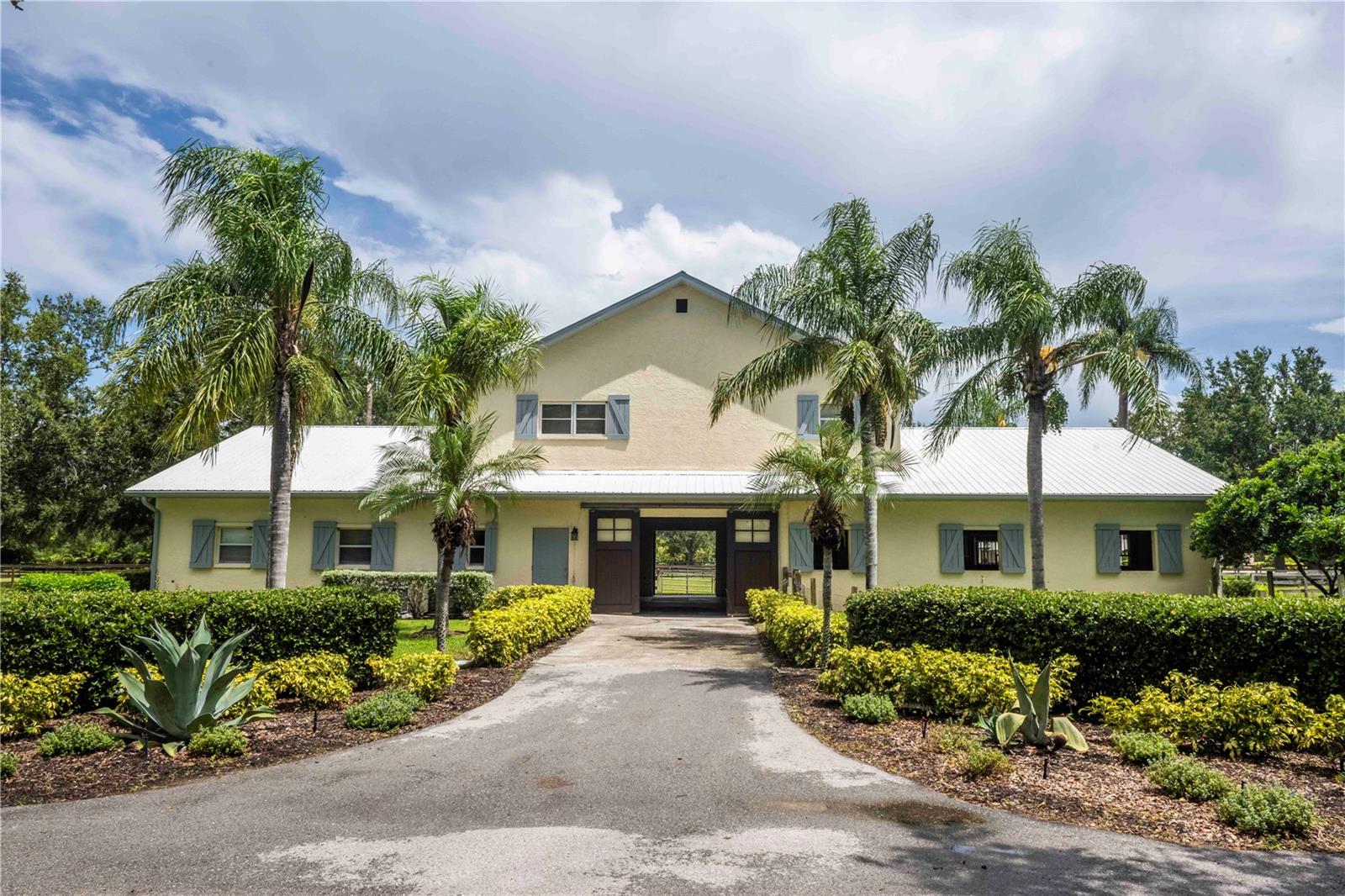 Welcome to a truly unique opportunity in the heart of Lakewood Ranch! This rarely available 9.7-acre property is nestled within the exclusive Sarasota Polo Club, offering a premier equestrian lifestyle just minutes from all the conveniences of town.

As you enter through the gates, you’re greeted by a stately oak-lined driveway that sets the tone for this remarkable estate. The property features a gorgeous 8-stall center-aisle barn with a spacious office, tack room, and a beautiful 2-bedroom, 2-bathroom apartment upstairs — perfect for owners, guests, or staff.

In addition, there’s a 16-stall barn complete with a 1-bedroom apartment, providing ample accommodations for horses, grooms, and trainers. Both barns are thoughtfully designed for functionality, comfort, and the highest standards of equine care.

Located within minutes of the acclaimed Out-of-Door Academy, this property is also a quick golf cart ride to Waterside, Lakewood Ranch where you can enjoy boutique shopping, lakeside dining, weekly events, and so much more. With ample space to build your dream home, this estate offers endless possibilities for creating your perfect equestrian retreat.

Whether you’re a polo player, competitive rider, or simply a horse enthusiast, this property offers an unmatched combination of location, facilities, and charm. Enjoy the prestige of the Sarasota Polo Club community while being just moments from shopping, dining, schools, and Lakewood Ranch’s vibrant amenities.

Don’t miss this chance to own one of the area’s most coveted equestrian properties!