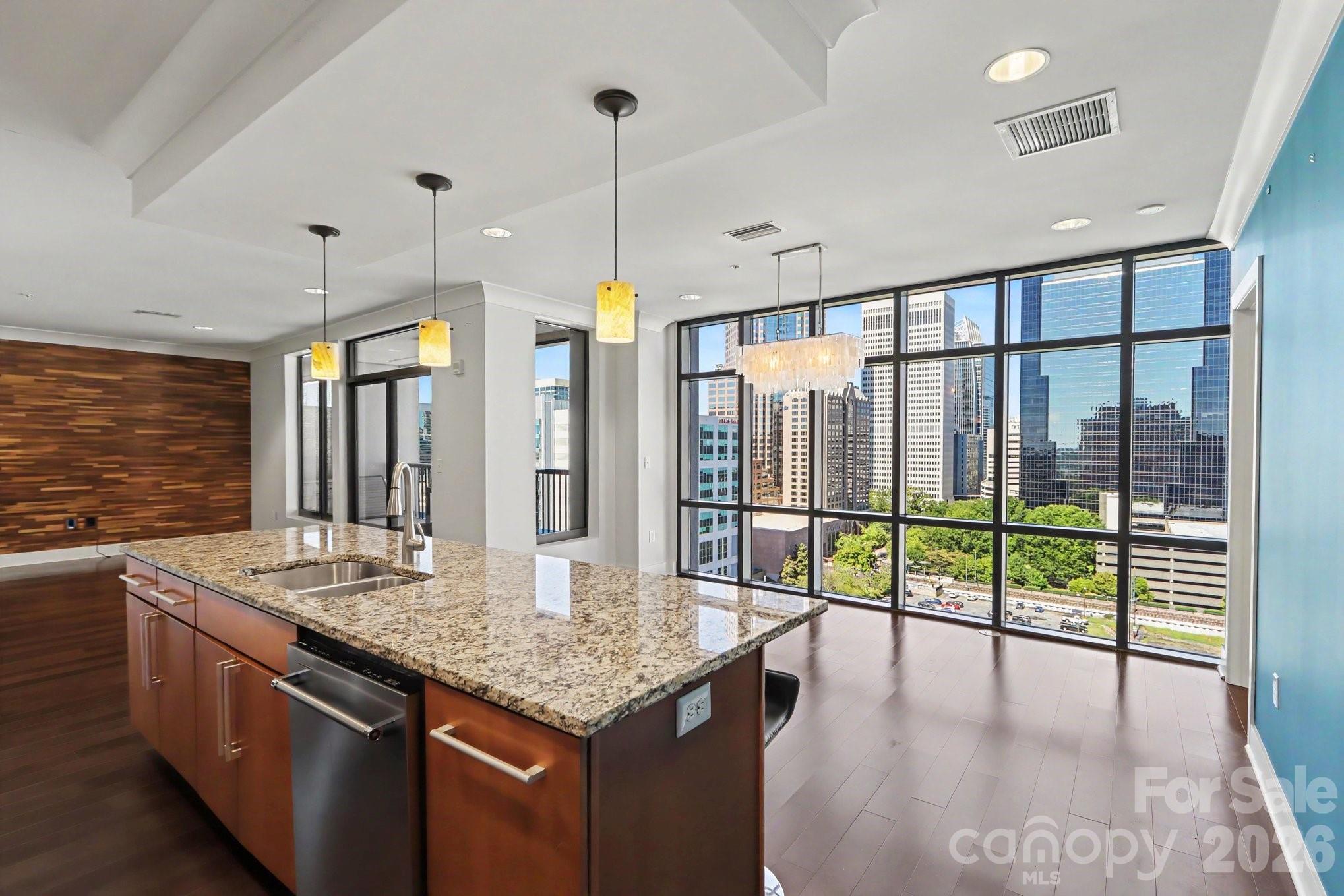 Uptown living at its finest! One of the few 1 bedroom units in uptown with over 1000 square feet! Here's your opportunity to own a corner unit featuring some of Charlotte's best views with tons on amazing amenities. Upon entering you'll find floor to ceiling windows, in both the living area and the bedroom. Unit features an open floor plan, perfect for entertaining and an updated kitchen! Building amenities include a fitness center, party room, and movie room. Minutes from Spectrum Center, Bank of America Stadium and everything else uptown Charlotte has to offer.