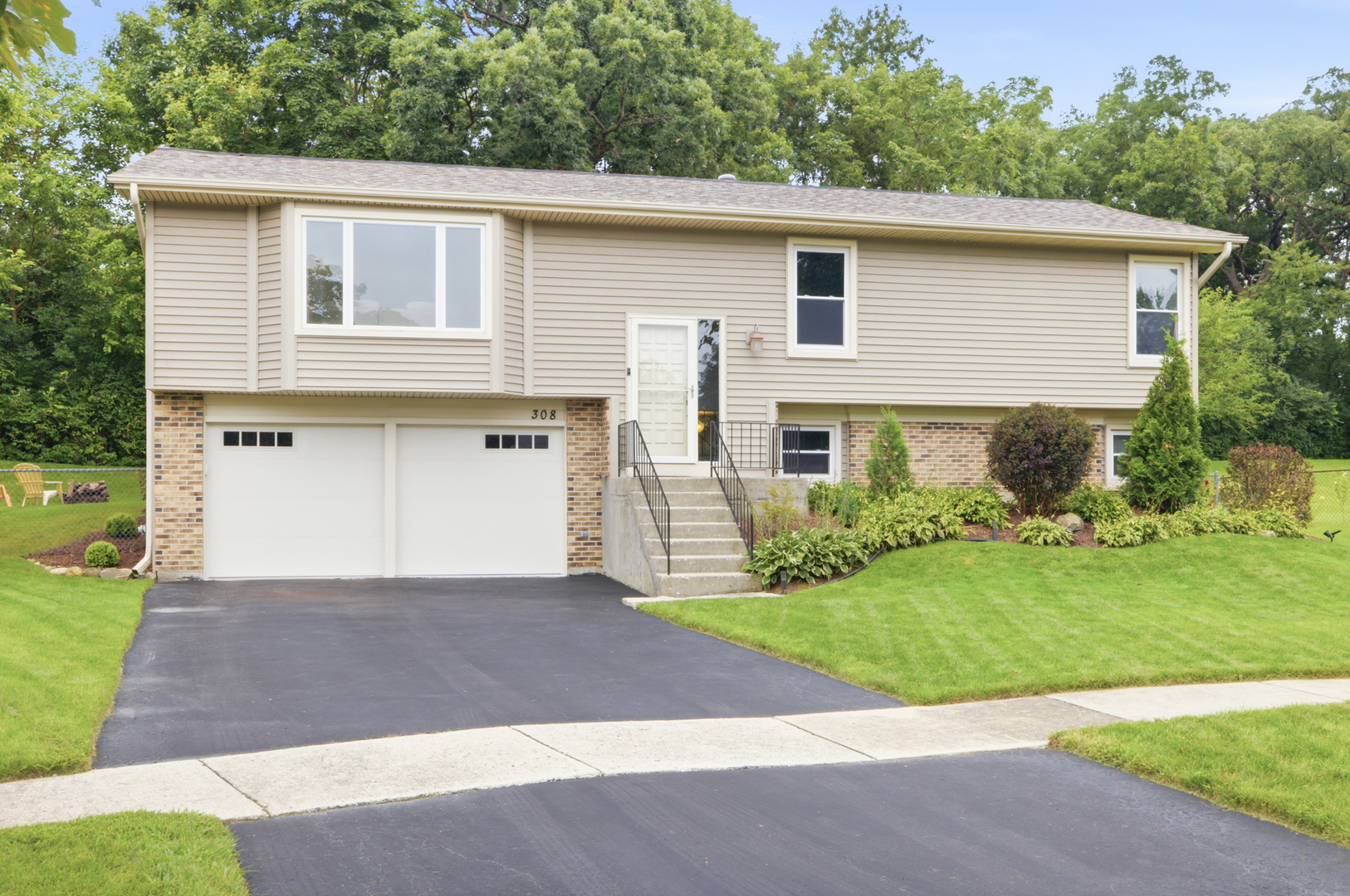 Welcome home to this inviting 3-bedroom, 2-bathroom home nestled on a quiet cul-de-sac, offering comfortable living spaces, an expansive private backyard, and a location served by Woodridge elementary and middle schools with Downers Grove South High School. The over-sized eat-in kitchen provides plenty of room for everyday meals and entertaining, with direct access to the enclosed porch and deck -perfect for enjoying the backyard in every season. A 2-car garage adds convenience and storage. Numerous updates provide peace of mind, including siding, windows, gutters and fascia (2011), garage door (2005), kitchen and upstairs bathroom flooring (2020), new light fixtures in the entryway and dining room (2024), painted white trim (2025), and freshly painted interior (2026). Don't miss the opportunity to make this well-maintained home your own!