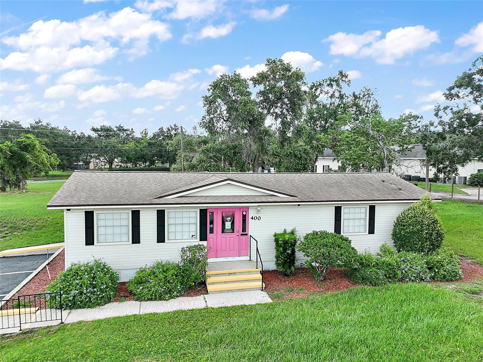 Under contract-accepting backup offers. Prime Commercial Office Space in the Heart of Clermont
Seize this rare opportunity to own a high-visibility commercial property located at the bustling intersection of Hwy 50, Anderson St., and E Highland Ave. With over 50,000+ vehicles passing daily, your business is guaranteed unmatched exposure!

This versatile office building has a rich history of success, previously home to a real estate office, a blinds company, and a mortgage & title firm—a true testament to its endless potential.

Property Features:
* Three private offices
* Two expansive rooms (formerly used as a conference and training room, easily adaptable to suit your needs)
* Newer roof, two bathrooms, hot water heater, and a kitchenette area with a sink
* 14 paved parking spaces
* Prominent street-front signage with LED lighting on a timer for maximum visibility
* Side street: Anderson Rd, Back Street: E Highland Rd (.529 acres) Frontage: Highway 50 (.5075 acres)
* Bonus: Additional lot included behind the building, making the total lot size just over an acre of General Commercial space.

Commercial properties with land in Clermont rarely hit the market—don’t miss this incredible investment opportunity! Just minutes from Downtown Clermont and the waterfront.

Call today for your private tour!