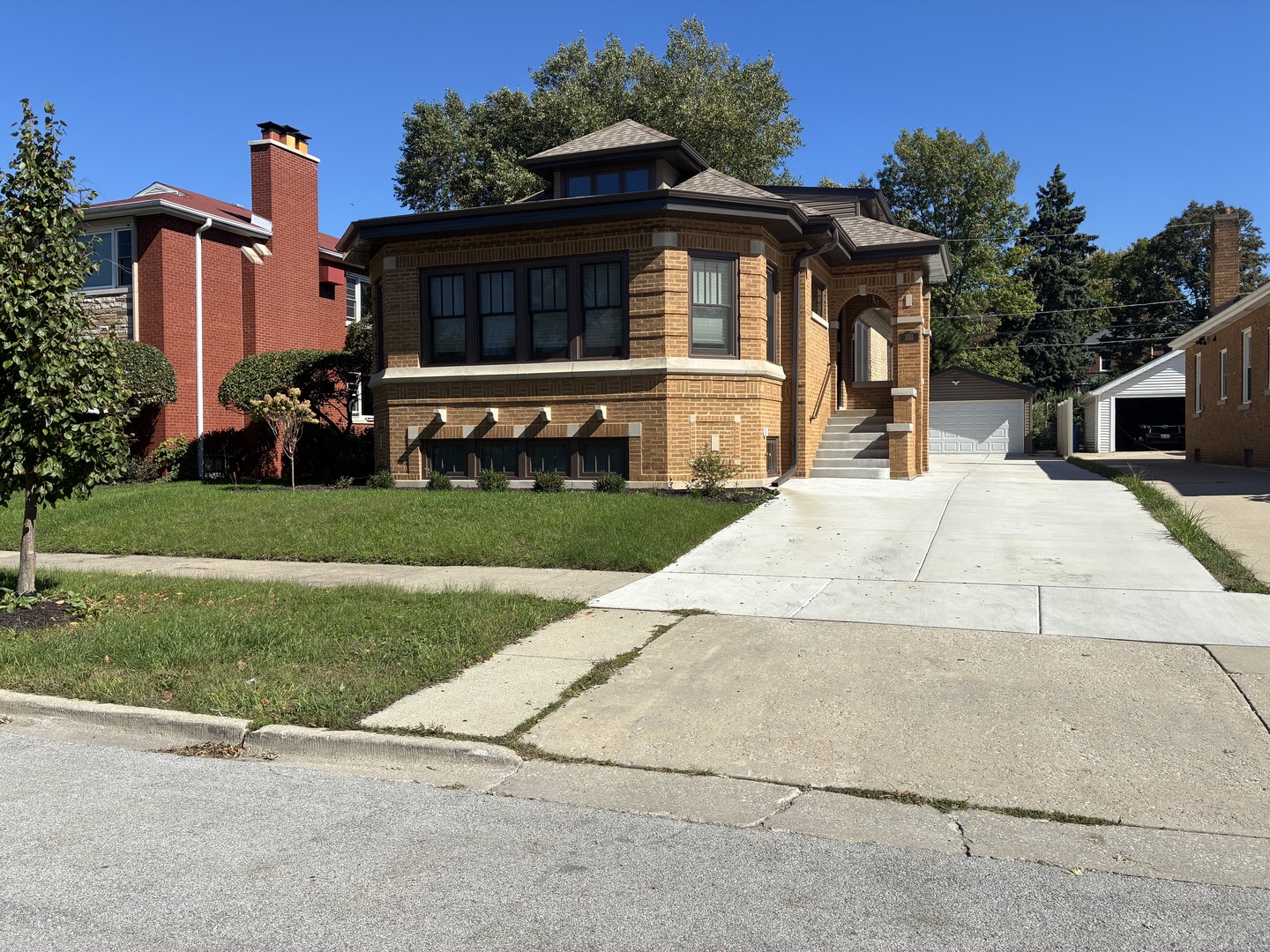 Welcome to this beautifully remodeled Chicago bungalow in the heart of Beverly, originally built in 1926 and fully renovated in 2026. Blending timeless architectural character with modern updates, this spacious 4-bedroom, 3-bathroom home offers comfortable living across a thoughtfully refreshed interior. The first floor features beautiful hardwood flooring, while the upstairs bedrooms are finished with brand-new carpeting for added comfort. The home's 2026 renovation brings a fresh, modern feel while preserving the charm and character of a classic Beverly bungalow. Outside, enjoy a newly landscaped yard, a new fence, and a cozy backyard space perfect for relaxing, entertaining, or enjoying the outdoors. The property also includes a 2-car garage for parking and additional storage. Situated in Chicago's historic Beverly neighborhood, this home offers the charm of a classic bungalow with the convenience and finishes of a newly remodeled residence.