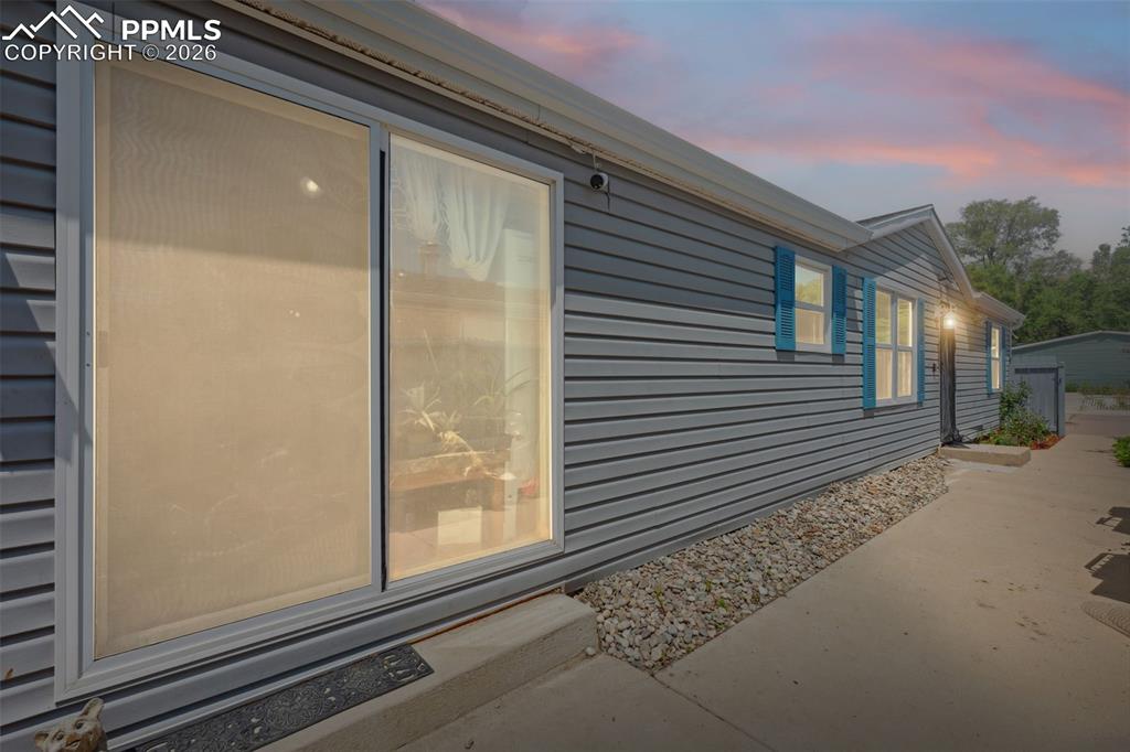 NO HOA, NO LOT FEE !!!! Yep - you heard that right! :-) BUT WAIT, it gets even better- Newer Roof, Solar Panels are paid off in FULL, and a water softener to convey with the property! This beautifully, well maintained, manufactured home offers the PERFECT blend of space, comfort, and functionality. Featuring 4 EXTRA large bedrooms with spacious closets - this home is ideal for anyone seeking generous living areas- whether you need room to relax, entertain company, work from home, or accommodate family members! HUGE kitchen with lovely counter tops and plenty of cabinet space. Living room has vaulted ceilings. Spacious master bedroom has adjoining 5 piece bath with updated tile and fixtures. Check out the 12 x 6 walk in closet! Tons of room! 3 more bedrooms, each with ample closet space! The exterior is fenced with areas perfect for a BBQ. Mountain views as well! Parking is as easy and simple as can be with 4-5 spots in the driveway right in front of the property! Easy commute to Ft. Carson & Colorado Springs! You don't want to miss out on this spacious, easy main-level living home!! Schedule your showing today!