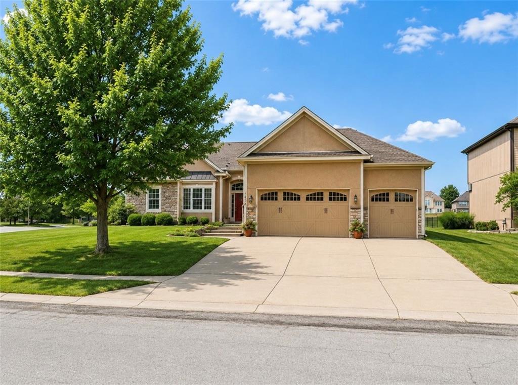 Beautiful Ranch Home in a Premier Lake & Golf Community. This stunning ranch home is ideally situated on a large corner lot backing to the 5th tee box, offering picturesque golf course views and the opportunity to relax by the pool while watching golfers drive down the fairway. The open-concept floor plan features a spacious kitchen with a center island, granite countertops, and a walk-in pantry, flowing seamlessly into the great room with soaring 14-foot ceilings, a dining area, and a cozy hearth room with fireplace. The expansive primary suite includes a sitting room with a fireplace, a beautiful remodeled en-suite bathroom, and a large walk-in closet. The primary bedroom also provides convenient access to the laundry room. The finished lower level offers exceptional additional living space, complete with a wet bar, large family room, and two oversized bedrooms. Step outside to enjoy the private heated in-ground pool and beautifully maintained outdoor living areas. HOA amenities include, access to the lake, clubhouse, tennis courts, swimming pools and walking trails. A rare opportunity to enjoy resort-style living with golf course views, abundant amenities, and spacious indoor and outdoor living areas.