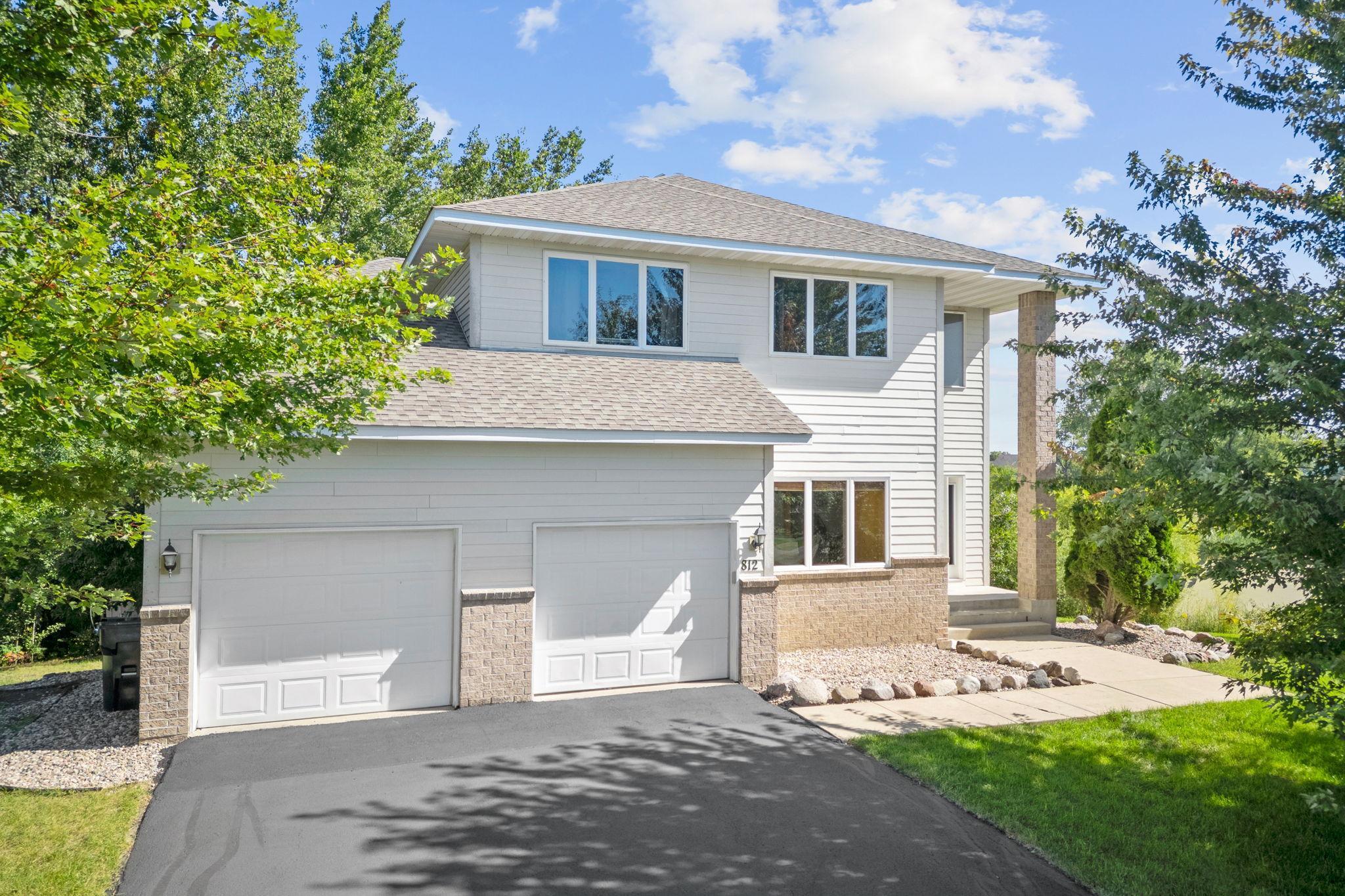ACTIVE - CONTINGENT, OK TO SHOW. Welcome to 812 Harvest Circle SW, a beautifully maintained home tucked at the end of a quiet cul-de-sac in the heart of Lonsdale. This spacious two-story offers over 3,200 finished square feet and sits on a generous lot with peaceful surroundings. Built in 2006 and thoughtfully updated, the home combines modern comfort with timeless charm. A new roof was installed just four years ago, the HVAC system was replaced only three years ago, and recent interior upgrades include a brand-new kitchen backsplash tile, main floor light fixtures, and freshly refinished hardwood floors that add both style and peace of mind for the next owner.
The main level greets you with soaring ceilings and abundant natural light in the great room, creating a warm and inviting space for everyday living. The kitchen is designed with both function and style in mind, featuring granite countertops, stainless steel appliances, an island with prep sink, and the new backsplash and matte black hardware that elevates the space with modern flair—perfect for family meals or entertaining guests. A main-level bedroom or office offers flexibility, while the refinished hardwood floors provide a crisp, polished finish throughout the living areas. Upstairs, the spacious primary suite feels like a retreat with its walk-in shower, jetted tub, and dual vanities. Additional bedrooms and bathrooms provide room for everyone, with plenty of storage throughout.

The fully finished walk-out lower level extends the living space with plush carpet and a cozy electric fireplace that makes the family room an inviting spot to relax. Another full bathroom, a large bedroom, and a flex room create endless possibilities—whether you need space for guests, hobbies, a home office or entertaining family and friends. Built-in storage under the stairs and a dedicated storage area ensure everything has its place. Step outside from the lower level to enjoy the private backyard, or head up to the oversized deck to take in summer evenings overlooking the property.

Beyond the home, the location adds even more appeal. Lonsdale Elementary School is just a short walk away. Scenic trails and nearby parks wind through the community, offering opportunities to walk, bike, or simply enjoy the outdoors. With its blend of thoughtful updates, flexible spaces, and a setting that balances privacy with convenience, this home is ready to welcome its next owners.