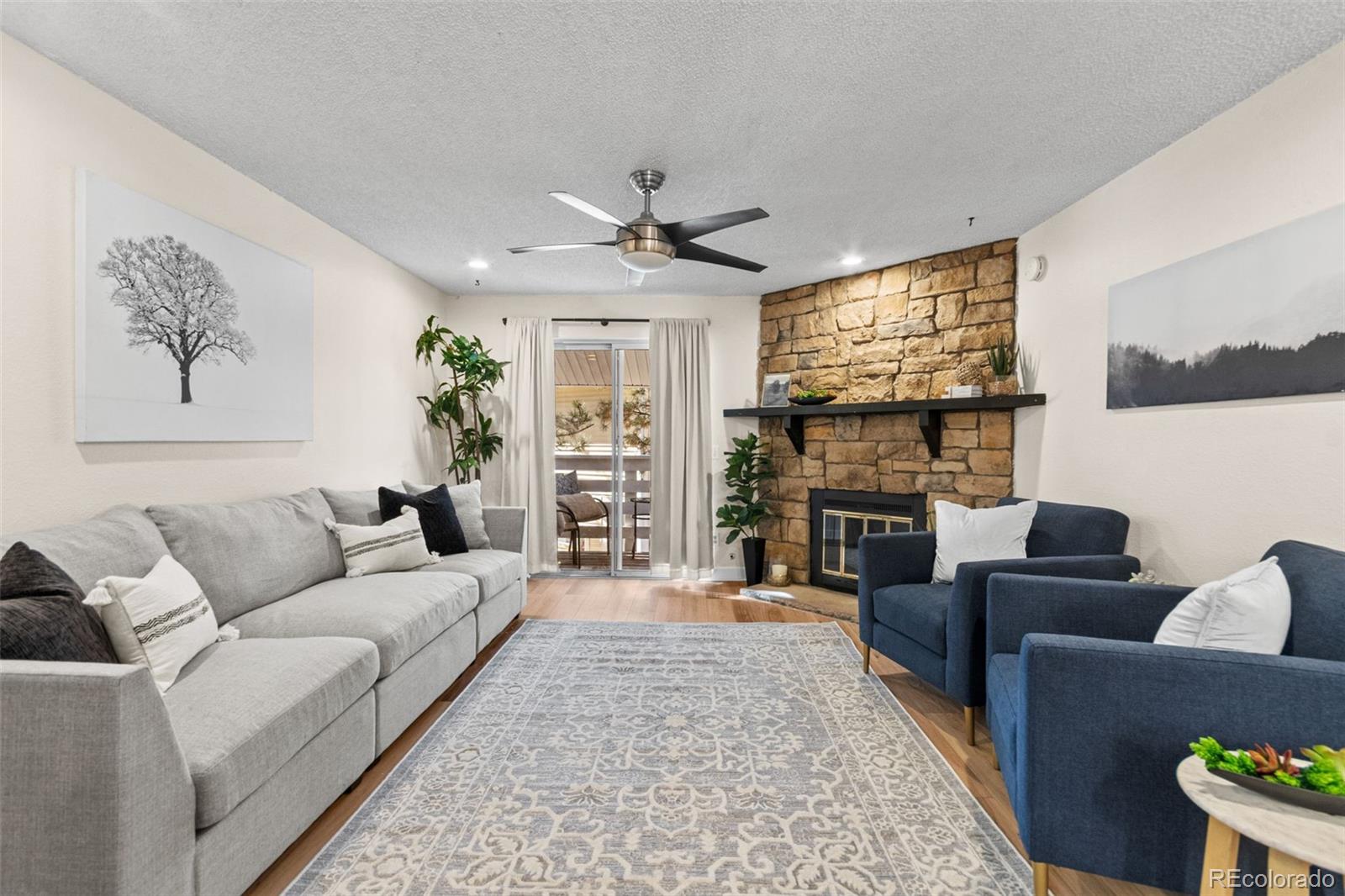 This beautifully renovated 2 bedroom/2bathroom home is ready to move in!  This is a coveted 2nd floor unit. Updates include: LVP flooring, granite counter tops, decorative tile backsplash, carpet, kitchen sink, and added ceiling fans. The interior has been recently painted. Furnace, AC, and all appliances were updated in 2022. Circuit breaker has been updated. The gas fireplace provides for cozy winter evenings. Woodside Condos is ideally located close to the shops and restaurants of Lowry Town Center, with easy access to CU Anschutz Medical Center, Cherry Creek and even downtown Denver. Bike trails are available close by. Don't miss your chance to own this great home or investment property.