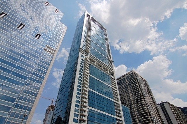 Another extremely rare opportunity to purchase a floor plan at the prized and highly sought after masterpiece from Related Midwest's 340 on the Park overlooking a true representation of the city of Chicago. This split 3 bedroom floor plan only exists on floors 15 through 24 with only 6 of these units having the floor to ceiling windows offering "forever views" of Lake Michigan, Monroe Harbor, Museum Campus, IN, MI, Soldier's Field, Maggie Daley, Grant and Millennium Parks, Buckingham Fountain and the Architectural wall of significant buildings from over 100 year old Chicago History to modern and contemporary residential and office complex designs along Michigan Avenue to the Willis Tower an the "Wedding Cake" building located at 311 S. Wacker Drive. Enjoy the best shaped 12'x10' additional room-like private terrace isolated from any neighbors to enjoy permanent views with no obstructions forever. This home features a foyer with the "money shot" as soon as Residence 2305's from door is opened of the southern view. Powder room and formal living room, separate dining room, and separate family/tv room. A very geometric rectangular floor plan with additional leg. Wake up facing south in a sumptuous primary suite equipped with walk-in closet, ancillary linen closet, dual vanity, separate soaking tub/shower, dressed in natural stone. Electric, quiet shades throughout this home. Highly sophisticated and upgraded music system. Extremely cleaned line, pristine  condition and pride of ownership. Bamboo flooring. Open kitchen concept located in the center of this home featuring beautiful flat panel wood Snaidero cabinetry complimented by upper frosted glass front cabinet doors. Culinary hood vents to the outside. GE Monogram appliance package featuring high output gas cooktop, building into cabinet oven and microwave. Second and third bedrooms located on opposite side on the set wing of this home with sheared full bathroom dressed in natural stone and bamboo vanity. Second means of egress of back door. Residence 2305 has the FLOOR TO CEILING WINDOWS. One heated garage parking (P3-76) and one storage locker (SM-1)  approximately 7' tall by 5' wide by 6' deep is included in the list price.   340 On the Park is a full amenity building with nothing spared. Our 25th floor includes a 4,000 square foot gym, 75' two lane indoor lap pool, Sauna, steam rooms, locker rooms, whirlpool, sun terrace, Winter garden/hospitality room, caterer's kitchen, two gas grills, activity chairs, table and lounges, private dining and conference room. Outdoor pet relief area and dry cleaners, access to pedway. 340 on the Park's reputation proceeds itself as the very best located Lakeshore East Building in the neighborhood. Lakeshore East Special District Tax has been paid for in FULL by sellers for he unit and the parking space. No obligation of this TAX will be passed on to the buyer.