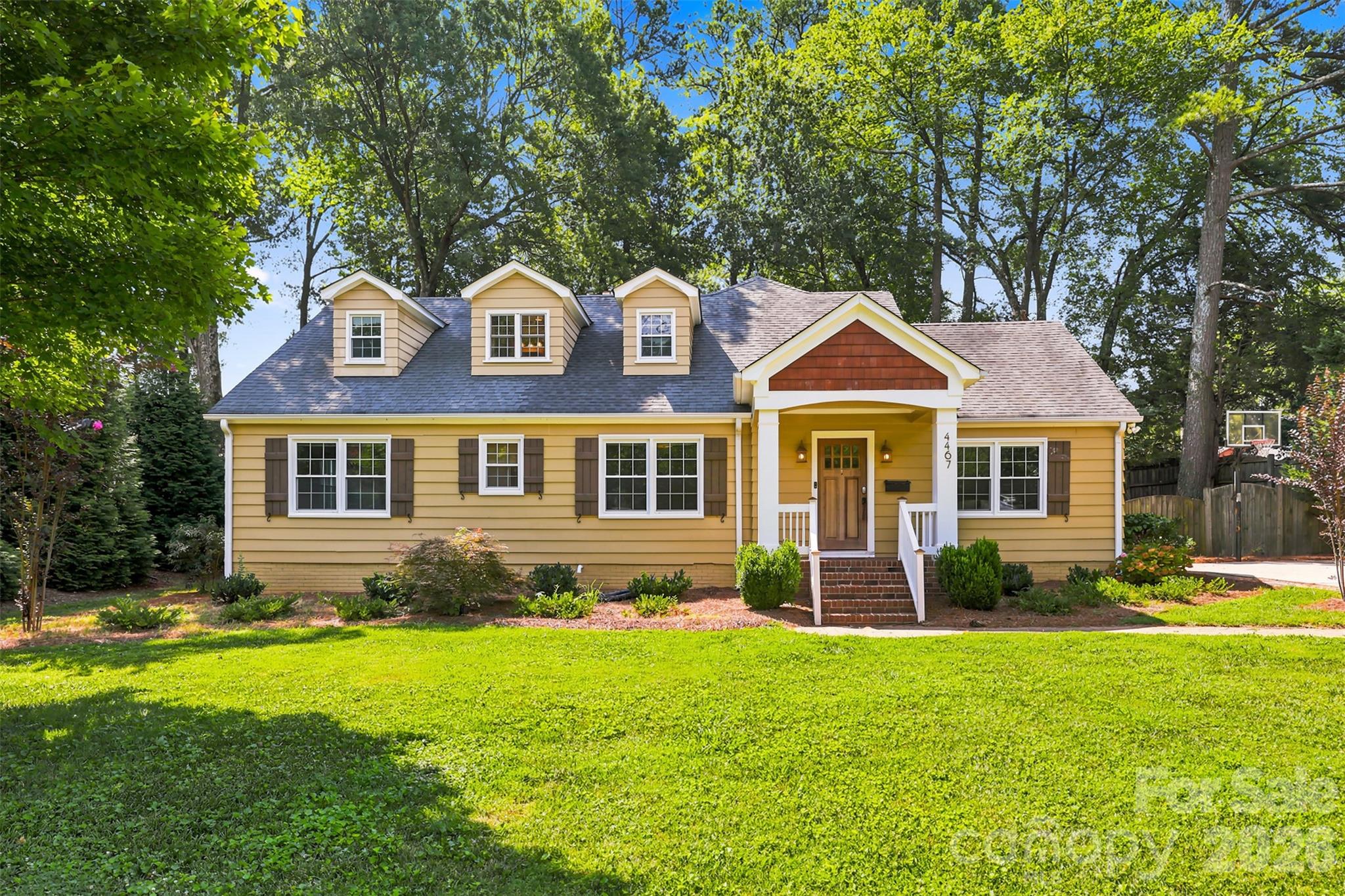 Bursting with timeless charm and character, yet also thoughtfully updated for modern living, this exceptional 5 bedroom/3.5 bath Cotswold residence offers more than 3,000 square feet of beautifully designed living space on a rare .439-acre corner lot. A welcoming covered front porch sets the tone for the warmth found within, where rich hardwood floors, custom built-ins and multiple wood-burning brick fireplaces create an atmosphere of classic elegance and comfort.At the heart of the home, the renovated chef's kitchen blends style and function with a generous center island, farmhouse sink, gas range, integrated refrigerator, accent backsplash and abundant workspace, making it equally suited for everyday living and effortless entertaining. Just beyond, the expansive patio overlooks a fully fenced backyard, creating a private outdoor retreat complete with a spacious storage shed for tools, hobbies and recreational equipment.The main-level primary is thoughtfully positioned for privacy, offering a peaceful escape from the home's gathering spaces. Two additional bedrooms, a full bath and an oversized laundry room complete the first floor with convenience and flexibility for a variety of lifestyles.Upstairs, two spacious bedrooms share a well-appointed full bath, providing ideal accommodations for guests, growing households or dedicated office and bonus space. Set in one of Charlotte's most desirable neighborhoods, this beautifully maintained home offers the perfect balance of character, comfort and generous indoor-outdoor living in the heart of Cotswold!2 of the bedrooms could be turned into a huge primary suite.