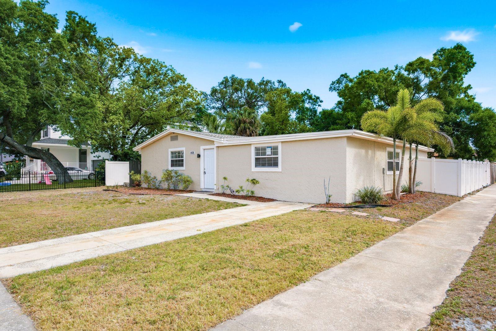 Bring your offers! COMPLETELY remodeled Tampa home with NO HOA and NEVER flooded through the past two hurricanes—offering peace of mind along with modern updates. Situated on a spacious CORNER LOT, this property features a NEW FENCE, side gate, and room for BOAT PARKING.Step inside to a bright, open layout with updated flooring, fresh interior and exterior paint, a custom accent wall, and stylish boho-inspired lighting. The home offers multiple living spaces, including a BONUS living room—perfect for entertaining, relaxing, or creating a separate hangout area.The kitchen flows seamlessly into the main living space and showcases quartz countertops, stainless steel appliances, a beautiful custom vent hood, tile backsplash, and a partial island with seating, plus a dedicated formal dining area for both casual and traditional dining.The primary suite features a huge walk-in closet and an additional BONUS room ideal for a home office, nursery, or private retreat. You’ll also love the oversized laundry room with butcher block countertops and abundant cabinetry.Major updates include a 2024 shingle and flat roof and a NEW WATER HEATER, adding even more value. The exterior offers a clean slate with plenty of potential to enhance curb appeal and make it your own.Move-in ready with thoughtful upgrades, flexible space, and a prime Tampa location—this one stands out.