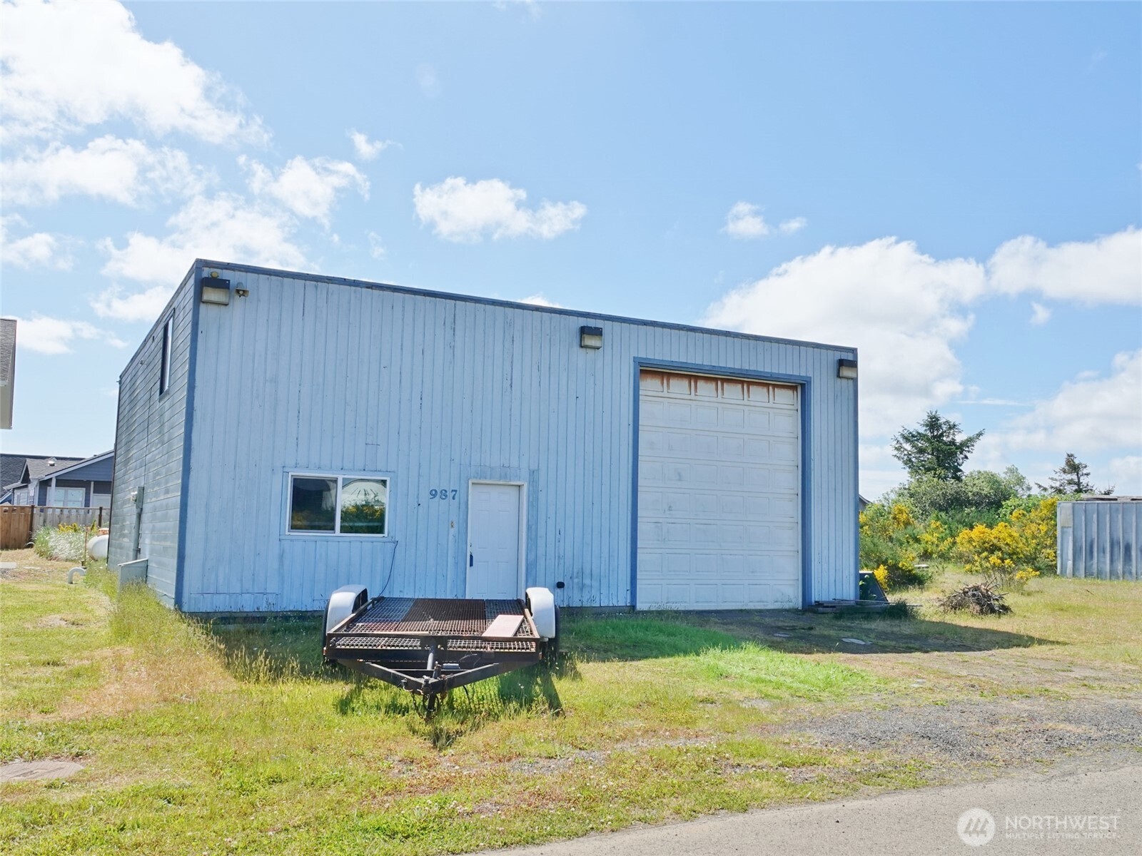 Live and work in the same residence! Located on a Commercial Lot on Beaver Ct off of Pt Brown Ave down by Damon Pt Beach. Huge 1,140 sq.ft. Garage with approx. 14' (h) x 12' (w) Garage Door, classic and gorgeous Wood Ceilings, lots of lighting, a huge hoist (approx. 10' high), Reznor Propane Heater, and a huge upstairs approx. 19' x 19' storage area with built-in shelves. Downstairs features 1 BD, 1/2-BA, and a Full Kitchen with all appliances, new dishwasher, washer/dryer, and a farmer's stainless steel sink. Upstairs features the Primary Bedroom with a sink and a mini-frig, and a 3/4-Bath. Large propane tank. Opportunity to turn this property into a nightly/vacation rental since it is on a commercial lot. Close to the Ocean Shores Community Club's Bayshore Clubhouse on the Bay.
