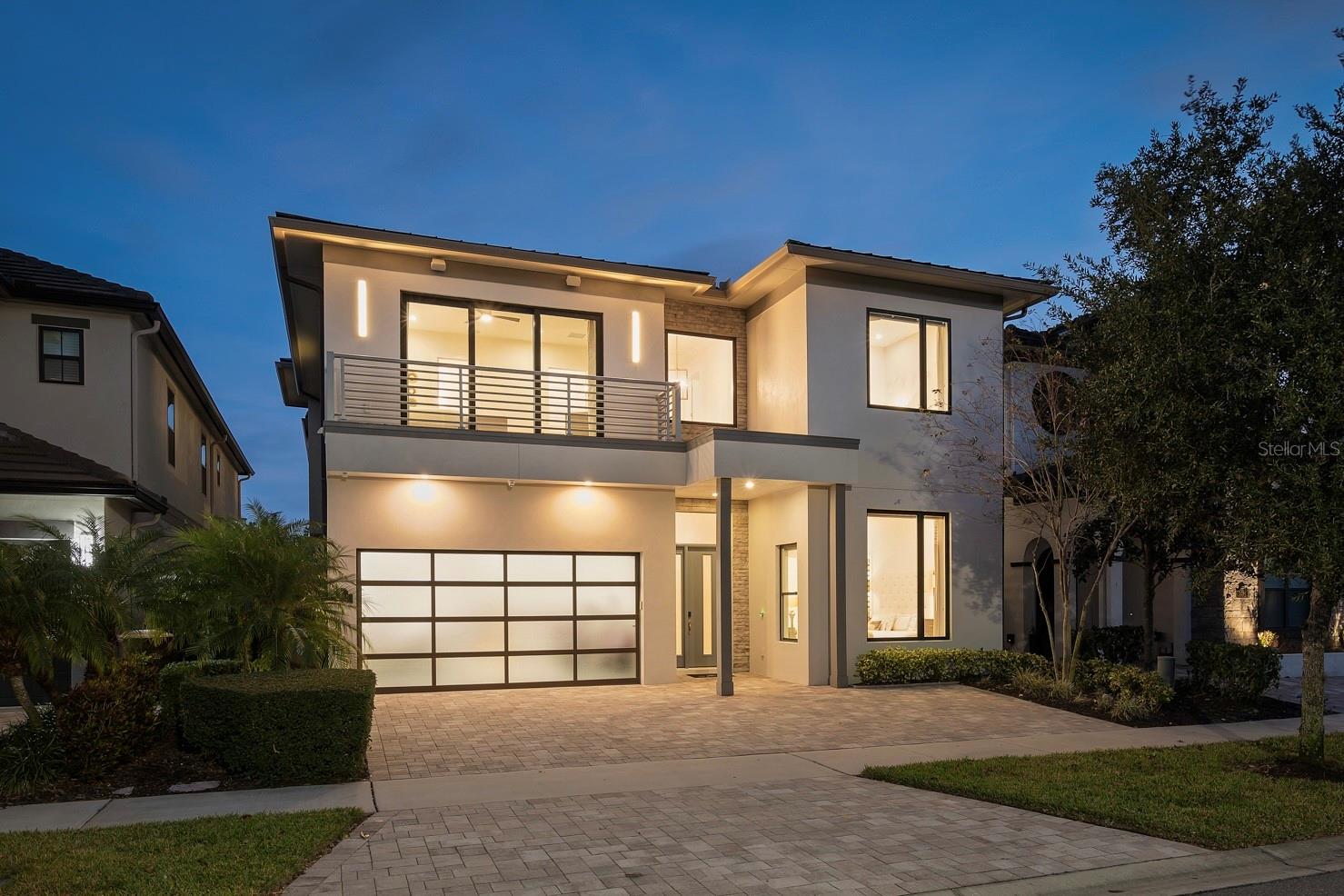 Located in the privately gated Bear’s Den neighborhood of Reunion Resort, this 8-bedroom, 8-full-bathroom, 2-half-bath home offers 5,625 heated sq ft and was built in 2018. The property has 12-foot ceilings on the first floor, a 2-car garage, and is offered fully furnished and turnkey. The home has never been rented and has only been used as a second residence. The kitchen features a double island layout, modern high-gloss cabinetry with lighted glass-front uppers, white quartz countertops, a JennAir gas cooktop with Zephyr range hood, two 36” JennAir built-in bottom-freezer refrigerators, a JennAir wall oven and microwave, and three JennAir dishwashers.The open living area connects to the outdoor space through corner sliding doors that lead to a covered patio with fireplace, a covered dining area with a built-in gas grill, vent hood, and sink, and motorized screens enclosing the entire space. The heated pool and spa include a sun shelf, an in-pool table with seating, and a pergola with a waterfall feature. An additional seating area with gas fire pit sits at the back of the pool, and a pool bath is accessible from the patio. The backyard has a private gate that leads directly into Golden Bear Park, available only to Bear’s Den residents. The park includes a putting green, great lawn, volleyball area, playground, and dog park.Every bedroom has its own bathroom, including two bedrooms on the first floor. The primary suite features dual sinks, a freestanding tub, a walk-in shower, and a walk-in closet. A second first-floor bedroom also includes an en-suite. The second-floor layout features a loft with a wet bar, dishwasher, pool table, seating area, and a covered balcony overlooking the pool and Golden Bear Park. Two additional primary suites each include dual sinks, a freestanding tub, a walk-in shower, and private balconies at the front and rear of the home. Bedrooms five and six include en-suite bathrooms with a private game room between them, and bedrooms seven and eight are also en-suites. Additional features include a Legrand built-in audio system with speakers throughout the home and outdoor areas, and a first-floor powder room. Two laundry areas—one on each floor—provide added convenience.Spanning 2,300 acres just 7 miles south of Walt Disney World, Reunion Resort is the only destination in the world featuring 3 signature golf courses designed by Jack Nicklaus, Arnold Palmer and Tom Watson. Reunion is also home to the Leadbetter Golf Academy. Onsite dining options include Eleven, 7593 Chophouse, Traditions, Grande Lobby Sushi Bar, the Clubhouse, the Cove, and Drifters at the waterpark. The water park features a lazy river, slides, outdoor games, and an aquatic playground. The gift shop in the Grande offers sundries and Starbucks coffee. Complimentary shuttles to the Disney transportation and ticket center leave from the Grande daily. Additional amenities include Camp Reunion, the tennis and pickle ball center, bocce ball, mini golf, foot golf, fitness center, playgrounds, dog park, various community pools including a roof top pool on the 11th floor of the Grande, and more. Zoning for short term rentals allows homeowners to rent their property by the night providing a great opportunity for investors. Reunion also works great as a primary residence or a private vacation retreat. The resort offers three separate 24 hour guard gated entries and one owner/resident only entry.