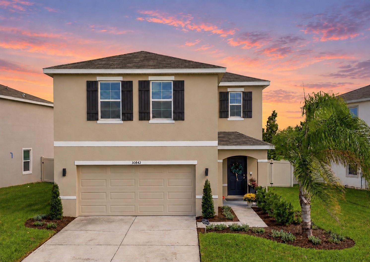 Virtually Staged. Welcome to The Lucky Penny, where comfortable living meets the vacation-inspired lifestyle of Epperson! Built in 2022, this spacious two-story home offers 4 bedrooms, 2.5 bathrooms, 2,260 square feet of living space, and a 2-car garage in one of Wesley Chapel's most exciting communities.Step inside to an open-concept floor plan that brings the kitchen, dining, and living areas together, creating a welcoming space for everyday living and entertaining. Whether you're preparing dinner, hosting friends, or enjoying a quiet evening at home, the connected layout makes it easy to do it all. Upstairs, a versatile loft provides additional living space that's perfect for a media room, playroom, home office, or whatever fits your needs. The spacious primary suite offers a walk-in closet and private bathroom with dual sinks and a separate shower, while three additional bedrooms provide plenty of flexibility for guests, hobbies, or work-from-home needs.Outside, the fenced backyard offers peaceful pond views and room to enjoy the Florida sunshine. Start your morning overlooking the water, enjoy time outdoors, or unwind in the evening while taking in the scenery.And then there's the Epperson lifestyle! Imagine having a tropical getaway just minutes from your front door. Epperson is home to Florida's first MetroLagoon, a spectacular 7.5-acre recreational lagoon with crystal-clear turquoise water and sandy beaches. Spend your afternoons swimming, kayaking, paddleboarding, enjoying water slides, or tackling the inflatable obstacle course. Prefer to unwind? Relax on the beach, reserve a cabana, or enjoy refreshments in a resort-style setting.Beyond the lagoon, Epperson offers walking and biking trails, parks, playgrounds, green spaces, a dog park, and community gathering areas. Seasonal celebrations, neighborhood events, and outdoor recreation make it easy to enjoy an active, connected lifestyle. ULTRAFi high-speed internet brings modern convenience to this amenity-rich community.Located in the growing Wesley Chapel area, The Lucky Penny also offers convenient access to shopping, restaurants, entertainment, healthcare, and I-75 for travel throughout Tampa Bay.With generous living spaces, a fenced backyard overlooking the pond, and an incredible community right outside your door, The Lucky Penny offers so much more than a place to live. It's an opportunity to enjoy the Florida lifestyle every day. Schedule your private showing and discover what makes this home and Epperson so special!