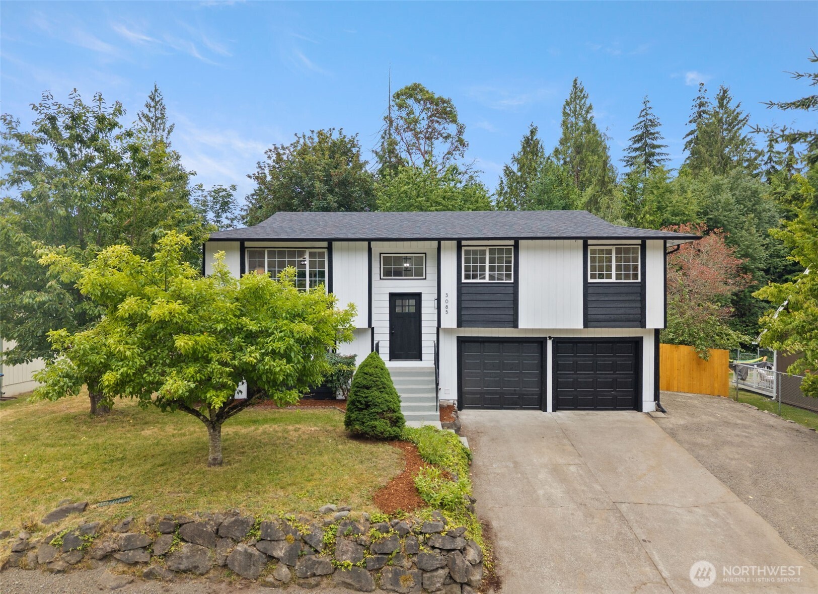 Beautifully updated home in the heart of Central Kitsap! Sophisticated but practical, this four bedroom, 2.75 bathroom home offers a flexible floorplan, with 3 bedrooms upstairs, including a spacious Primary Suite with its own chic attached bathroom. Well-designed living area, complete with fireplace and gleaming LVP floors, with an effortless flow into the custom kitchen, with quartz countertops and Stainless Steel appliances. Downstairs offers a 4th bedroom, full bathroom and second living space, perfect for multi-generational living, roommates, or just a great space for guests! Multi-level deck attached overlooks the fully fenced backyard which backs to a green space for additional privacy, making an ideal setting for memorable days outside with friends. RV or boat parking, so bring your toys! Bonus: newer windows throughout, indoor laundry downstairs and walking distance to schools within the award winning Central Kitsap School District.