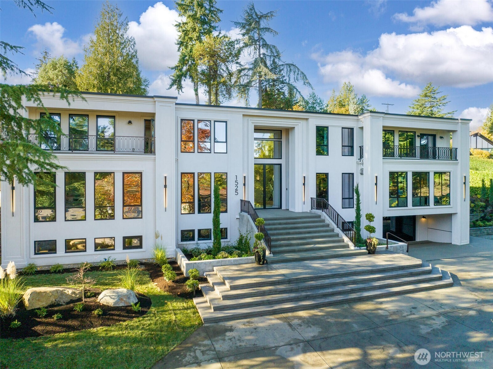 Built in 2023, this is one of the most extraordinary new construction home Medina has ever seen - an irreplaceable modern retreat across from the prestigious Overlake Golf & Country Club. Spanning over 9,000+SF, it features 5 en-suite bedrooms, 9 baths, soaring ceilings, and 10-foot gallery style hallways. Floor-to-ceiling triple-pane windows frame breathtaking views from manicured fairways to the Bellevue skyline. Designed with solar power, advanced smart features, private theater, gym, office, outdoor kitchen, and a detached Sky Lounge, it delivers unmatched luxury. Set on a discreet, elevated lot, the home offers rare privacy while being steps from elite amenities. This one-of-a-kind opportunity may never come again. (staging removed)
