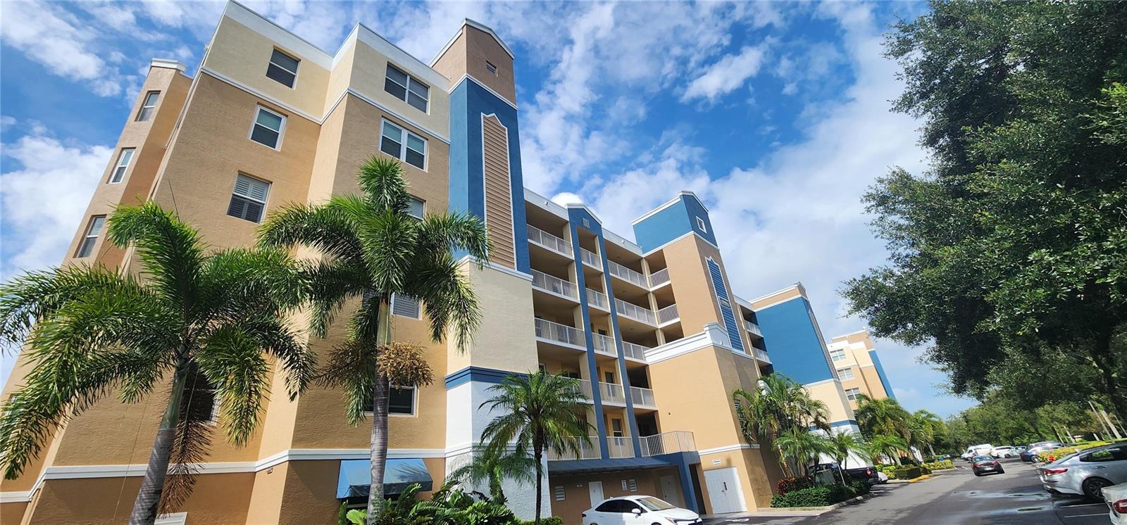 A SPECTACULAR condo in the much sought after Golf Lake Condominiums! This beautiful 2 bedroom, 2 bath unit boasts a fabulous floor plan highlighted by an open kitchen with all appliances, a wonderful dining room/living room combination with a laminate wood flooring, a huge master bedroom and bathroom with his and her closets, a large guest room with a private bath nearby. The kitchen has a large pass-through to the dining room and all of the necessary appliances. The master suite is suitably large with a private door out to your screened enclosed patio overlooking the trees and lake area. There is also a private parking spot right in front of the building providing you with the quick access to the secured elevator. This is a must see!