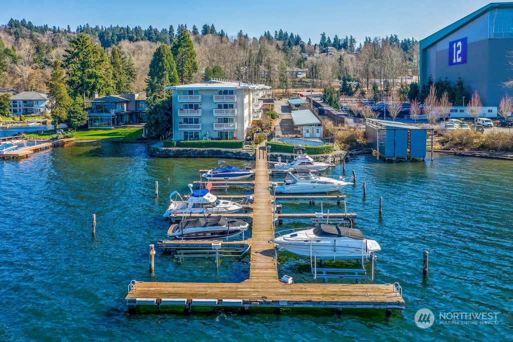 LAKE.WASHINGTON.VIEWS. Welcome to #102 at Misty Cove, a south facing condo in the desirable Kennydale neighborhood. Beautifully maintained main level unit is updated with hardwood floors and warm paint colors. Remodeled kitchen has wood cabinets and flows into the open living & dining rooms. Relish the abundant light coming through the large sliding glass doors. Primary bedroom has a large closet and private bath. Both bathrooms have been updated with luxury finishes. Relax and enjoy the deck overlooking Lake Washington. One designated parking spot. Misty Cove homeowner's association amenities include swimming pool & sauna.