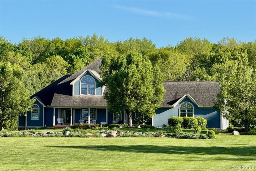 Custom built home in Hunt Country on a beautiful 10+ acre parcel, set far back off a paved road with views of a sparkling pond and Gazebo! These owners spared no expense in constructing their dream home starting with a striking elevation and using maintenance-free brick and Hardy board complemented with cedar. Professionally landscaped and patio pavers everywhere - walkways, parking pad and lower level patio. Perennials and ornamental trees, large sitting porch and gleaming hardwood floors greet you as you enter a spacious foyer to a vaulted living room with wall to ceiling Herd windows, custom shades and two-way fireplace to the Hearth room off the kitchen. Entertain with informal dining in an octagonal heated sunroom with views of the property off a bright and sunny kitchen with center island, loads of cabinets and huge pantry. Laundry room and half bath and useful Butler's pantry leads to formal dining with custom drapes. A lovely primary suite and spacious bedroom features views of the grounds and a bright ceramic bath highlighting a raised Jacuzzi Whirlpool tub, large shower and 2 separate closets. For family, a staircase to the 2nd floor Jack 'N Jill bedrooms remind you of Mackinac Island with design and decor, and practical vanities are separate from the bath. An additional bedroom is used as an office, and a 2nd staircase leads to a private craft room or library. The lower level is finished with a large family room, attractive Vermont stove, 2nd kitchen with 18' raised bar and full bath and doorwall to the landscaped patio and grounds for outdoor entertaining. Two huge storage rooms, a second laundry, gas or electric, geothermal heat, 110 amp electric and a Guardian Alarm system. Attached 2.5 car garage, insulated and finished with staircase to access the basement for ease in moving things in and out. Propane heats a 2-way fireplace! 36x40 barn has heat, 4" concrete floor, water, 110 & 220 electric, 10x10 & 12x12 overhead doors, 2 lean-to's! See exclusions.