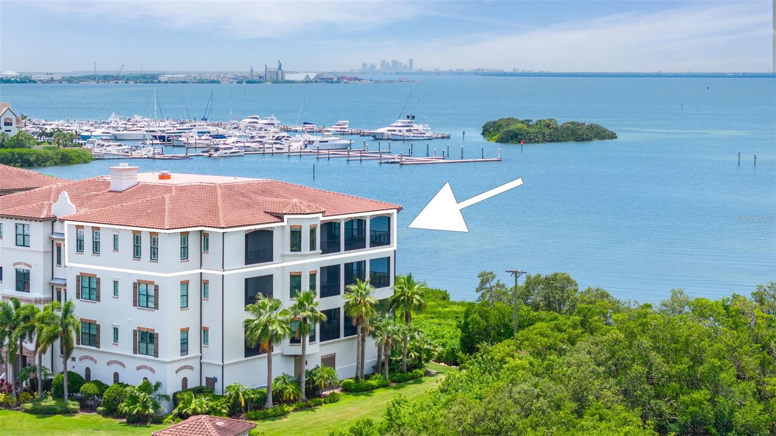 Under contract-accepting backup offers. Rare CORNER PENTHOUSE Offering Premier Waterfront Luxury at Westshore Yacht Club! An extraordinary opportunity to own one of the most sought-after corner penthouse residences in the exclusive, resort-style community of Westshore Yacht Club. This impeccably designed condominium offers 2,982 sqft of interior living space and 700+ sqft of private outdoor terraces, all showcasing unobstructed views of Old Tampa Bay. It is the true definition of Florida waterfront luxury living, where you can enjoy rare corner views, total privacy, and front-row seats to breathtaking sunsets, all within one of Tampa’s most inclusive and amenity-rich gated communities. Step off your private elevator into an expansive, light-filled open floor plan with 10-foot tray ceilings, engineered hardwood floors, and floor-to-ceiling sliding doors that frame the bay’s stunning sunset vistas. The oversized, west-facing lanai offers sweeping eastern and western exposures and is perfect for entertaining or unwinding as you watch the boats glide by. The chef’s kitchen features granite countertops and backsplash, a gas cooktop with range hood, convection oven, microwave, Sub-Zero Refrigerator and KitchenAid stainless steel appliances. The adjacent dry bar with a wine cooler, expansive center island with seating, and spacious dining area create the perfect setting for both casual get-togethers and elegant entertaining. Additional thoughtful upgrades include remote-controlled blinds, and 2025-installed remote hurricane shutters for peace of mind. The luxurious primary suite offers a peaceful retreat, complete with a private screened terrace, a spacious custom-designed California walk-in closet, and a spa-inspired bath with an oversized walk-in shower and soaking tub. Two additional en-suite bedrooms, an office/den with built-in cabinetry, a spacious laundry room, and a tankless gas water heater (2023) complete this exceptional layout. The unit also comes with two designated garage parking spaces in Casa Bahia, as well as a generously sized private storage room. Westshore Yacht Club offers residents a resort-style lifestyle with exclusive access to a 149-slip deepwater marina, two heated pools with towel and bar service, fine and casual dining at the Bay Club and 806 Lounge, 24-hour fitness center, spa services, dog park, playground, and year-round resident events. Perfectly located just minutes from Downtown Tampa, Downtown St. Pete, Tampa International Airport, and the Gulf Coast’s world-class beaches — this exceptional residence offers the rare blend of privacy, luxury, and vibrant coastal living. Don’t miss the chance to own this spectacular waterfront home. Schedule your private showing today!