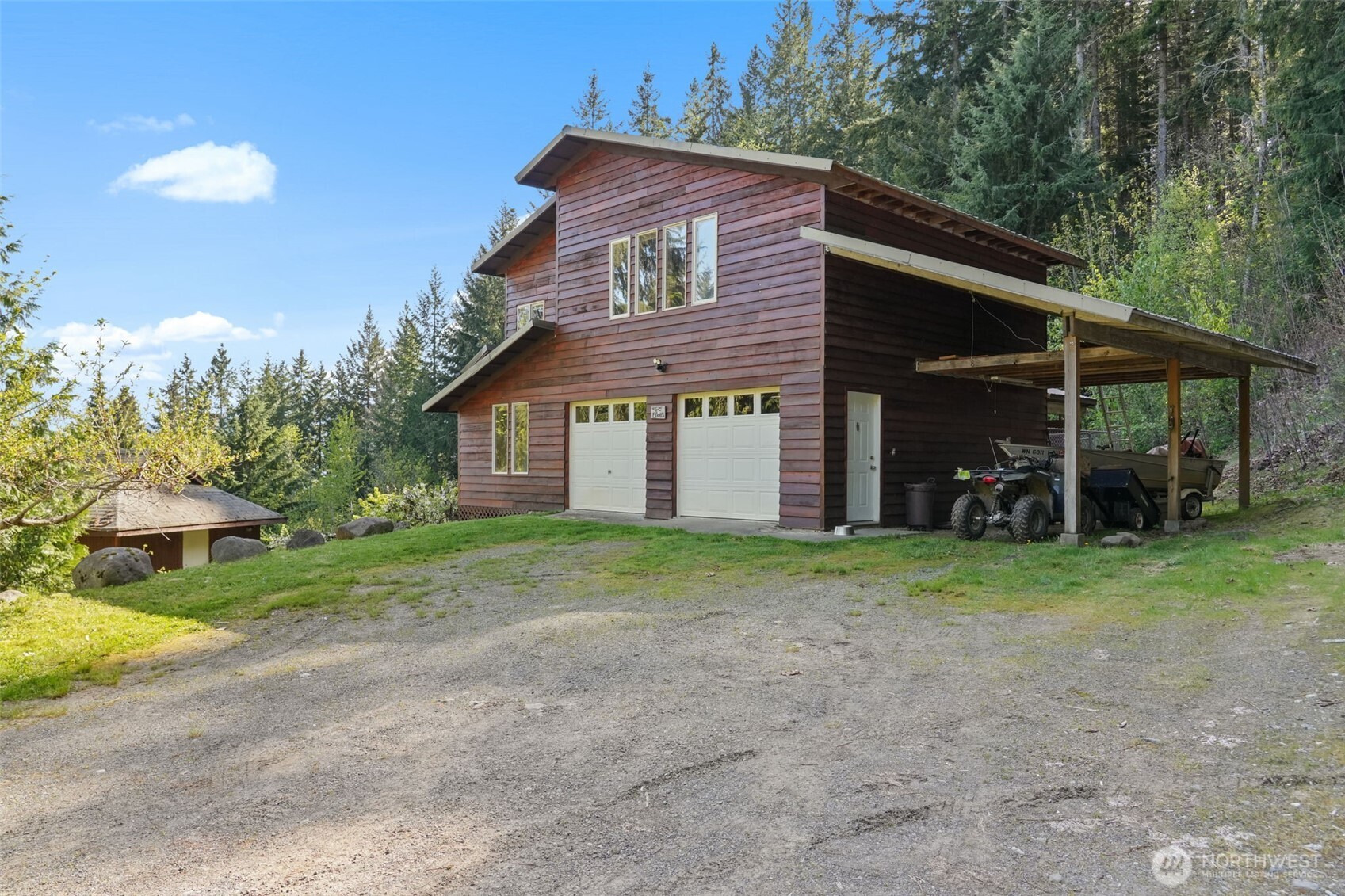 Soak in panoramic views of Mt. Adams from your own private slice of the Pacific Northwest. This secluded 8.2-acre retreat backs directly to Gifford Pinchot National Forest, offering unmatched access to hiking, foraging, and endless outdoor adventure. The 3BD/2.25BA, 2,786 sq ft home blends comfort and craftsmanship with hardwood and marble floors, a woodstove for cozy evenings, and a private primary suite. Outbuildings, garage, carport, and RV cover offer space for gear and projects. Mature fruit trees, garden space, and rich southern exposure make this a homesteader’s dream. No neighbors, no noise—just wild beauty and mountain air.