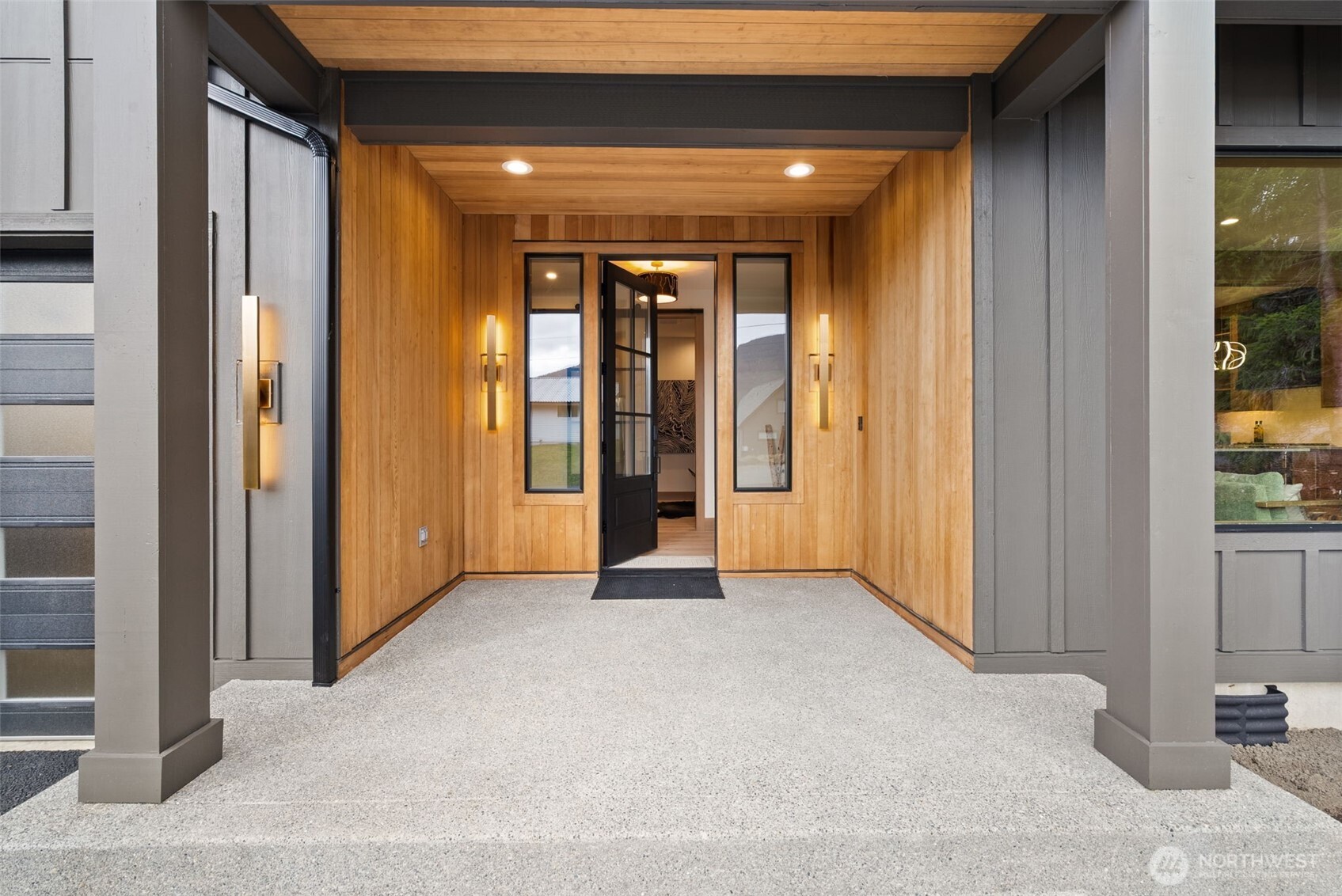 Ski White Pass, hike, walk to Cowliz river & town. Resort lifestyle elevated in this new home on large lot w/2 primary suites, attached ADU above garage & the best of indoor/outdoor living. Designer selected throughout. Wood accent entry wall, metal & glass barn door to mudrm/laundry. High grade LVP, great room w/gas linear fireplace w/floor to ceiling lrg format tile. Slider to outdoor covered living, wood ceiling, prewired for heater. Kitchen w/custom thin shaker trim cabinets, Quartz counters, full height tile backsplash, GE Café appliances & custom wood gas range hood. Showstopper open pantry w/floating shelves, window & counter to ceiling tile backsplash. Main level primary ensuite w/beautiful deco tile walls, shower bench & generous mirrored door closet. Guest bath w/acoustic wood accent wall, Upper level 2nd primary w/peek-a-boo downtown Packwood view, blt-ins, walk-in closet & ensuite w/full tile shower w/glass barndoor. Addtl bdrm, full bath & spacious loft. Separate slate entrance to ADU, ideal for rental, guests & addt'l space w/vaulted ceiling, view, wagon wheel chandelier, breakfast bar, custom cabinets, undercounter fridge, combo micro/airfryer/convection, bdrm w/closet & bath w/tile surround shower. High end features, 10' ceilings on main, 8' on 2nd level, wired for EV, designer LED lighting & pendants, hardware & surfaces. Lrg, partially fenced lot, dead end st, patio & firepit. Watch Elk, Eagles & wildlife from this one-of-a-kind home built by local builder.