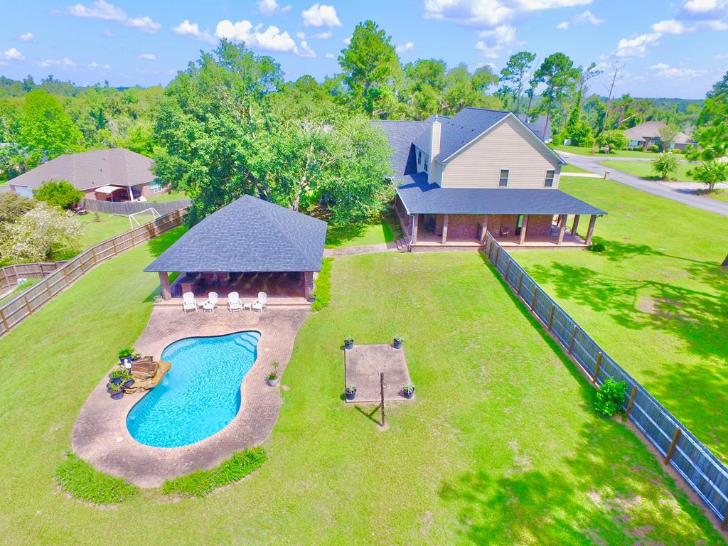“NEW ROOF  4 A/C SYSTEMS REPLACED”  NEW FENCING  1.2 ACRES  SALTWATER POOL  70'  35' CLIMATE-CONTROLLED GARAGE  34'  34' OUTDOOR PAVILION  VIKING APPLIANCES  FURNISHINGS NEGOTIABLE                         DESCRIPTION: MAJOR UPDATES  RESORT-STYLE LIVING  EXCEPTIONAL GARAGE & ENTERTAINMENT SPACE Unparalleled Luxury.                                                  Custom-built 4,200-sq.-ft. brick estate on 1.2 acres in Cypress Lakes with a NEW ROOF, 4 A/C SYSTEMS REPLACED, and BRAND-NEW FENCING.                      The open-concept interior features porcelain tile, hickory flooring, and a gourmet kitchen with granite island, prep sink, cherry cabinetry, six-burner Viking gas cooktop, and double ovens. The great room offers a stacked-stone fireplace and custom cherry entertainment center. A formal dining room and downstairs mother-in-law/guest suite with full bath add flexibility.  Upstairs features a spacious primary suite with walk-through shower and oversized custom closet, plus guest rooms, home theater with high-end projection, game room, and workout/flex space.                      Outside features  34'  34' redwood pavilion offers a full outdoor kitchen, granite surfaces, and brick fireplace overlooking the saltwater pool with rock fountain. A wrap-around porch adds even more outdoor living space.   The climate-controlled 70'  35' garage accommodates up to six vehicles, with separate covered storage for a boat, golf cart, or recreational equipment. Additional features   Walk-in attic, copper piping, and five A/C zones.      Negotiable. features.                                                 Furniture, decor, and kitchenware are negotiable with an acceptable offer. Near the community playground, running track, and Cypress Lake, this property combines major updates, resort-style amenities, exceptional entertaining space, and extraordinary garage capacity.