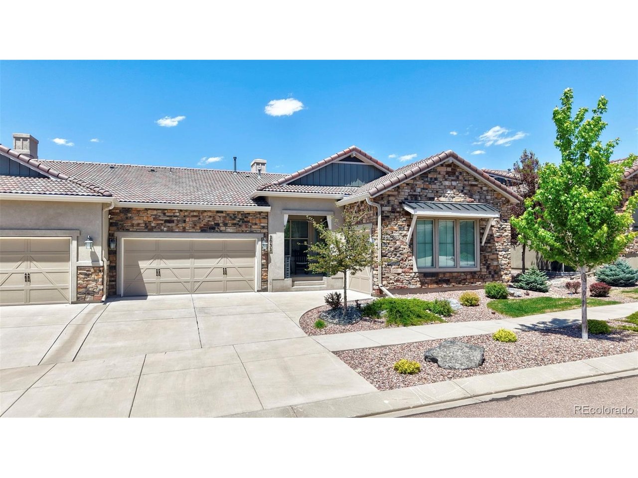 Welcome to luxury living in the highly sought-after Flying Horse community of Colorado Springs! This exceptional ranch-style patio home offers 3,846 square feet of thoughtfully designed living space with low-maintenance living and premium amenities. Featuring 4 spacious bedrooms, each with its own private bathroom, plus a 1/2 bathroom on the main level for guests, this home provides outstanding comfort and privacy for family members and guests alike. The open and functional floor plan offers multiple living areas ideal for everyday living and entertaining. The expansive finished basement is designed for gathering and relaxation, featuring a large family room, wet bar, and abundant space for game nights, movies, or hosting friends and family. A 2-car attached garage and separate 1-car attached garage provide plenty of room for vehicles, storage, and recreational equipment. Enjoy the convenience of a fully maintained yard, allowing you to spend more time enjoying the incredible lifestyle that Flying Horse has to offer. Residents have access to world-class amenities including the Flying Horse Golf Club, clubhouse, award-winning steakhouse, dining options, fitness facilities, and miles of scenic surroundings. Located just minutes from some of Colorado Springs' newest entertainment destinations, including Ford Amphitheater, Topgolf, Wolf Creek Lodge, and a variety of shopping, dining, and recreational attractions. Convenient access to the United States Air Force Academy, I-25, and an easy commute to Peterson Space Force Base and Fort Carson make this an ideal location for military personnel and professionals alike. Rarely do ranch patio homes offering this much space, privacy, and lifestyle become available in Flying Horse. Experience luxury, convenience, and maintenance-free living in one of Colorado Springs' premier communities.