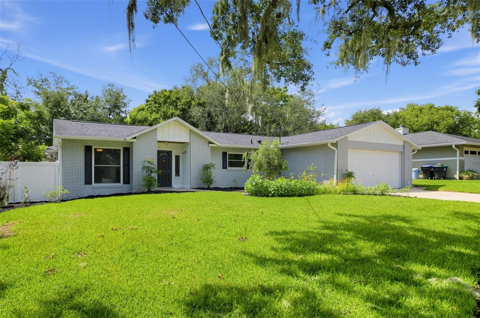 Welcome to this charming 3-bedroom, 2-bath home featuring a bright and open layout with fresh interior finishes and new flooring throughout the main living areas. The kitchen offers stainless steel appliances, a center island, and a stylish backsplash, creating a great space for cooking and entertaining. The living area opens to a screened-in patio overlooking the backyard and sparkling pool, offering the perfect spot for relaxing or enjoying the outdoors. With a private pool, backyard, and inviting indoor spaces, this home offers comfort, functionality, and plenty of room to enjoy