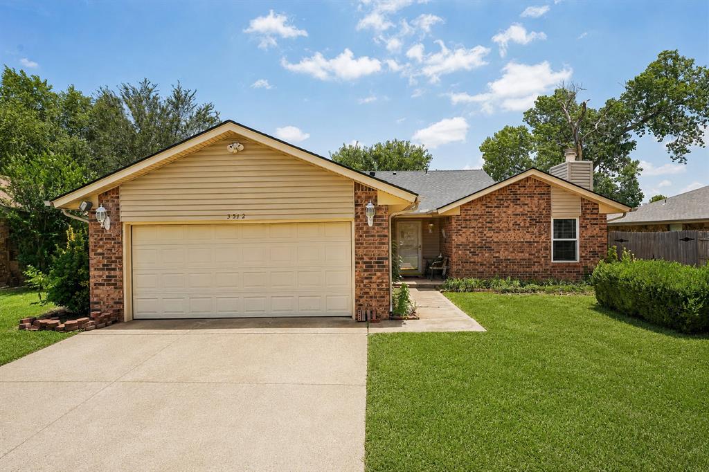 Well-maintained 3-bedroom, 2-bath home with numerous updates throughout. The spacious living room features a wood-burning fireplace with built-in shelving, cabinets, a mantel, and a new ceiling fan. Fresh interior paint, updated windows, new tile flooring in the kitchen, dining area, and hallways, plus new carpet in all bedrooms give the home a fresh, move-in-ready feel.The kitchen offers Corian countertops, ample cabinet space, a pantry, and a sliding glass door leading to the covered patio. The primary suite includes a walk-in closet and private bath with a single vanity. An inside laundry room with upper cabinets provides additional storage.Enjoy the large, fenced backyard complete with a covered patio, storage shed, and storm shelter. Conveniently located near I-35, shopping, restaurants, and within the Moore School District, this home combines updated features, functional living spaces, and an excellent location.