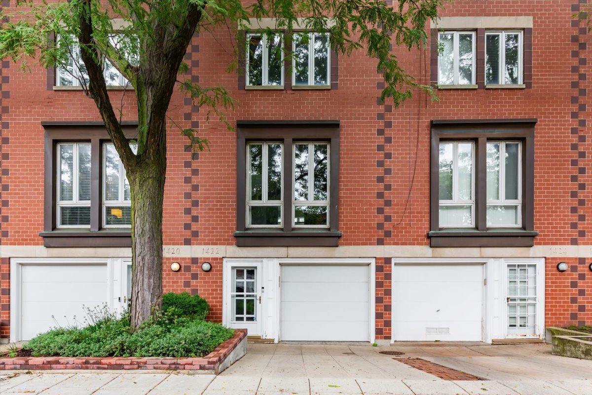 Experience sophisticated city living in this beautifully appointed tri-level townhome, ideally situated within the sought-after gated community of Dearborn Park II. Bathed in natural light and thoughtfully updated throughout, this exceptional residence offers an elegant blend of style, comfort, and effortless indoor-outdoor living. The recently enhanced main level is designed for both refined entertaining and everyday enjoyment. The beautifully updated kitchen features banquette seating, a breakfast bar, and direct access to an expansive Trex deck-an inviting setting for alfresco dining, morning coffee, or evening gatherings. A stunning, fully renovated bath adds a luxurious finishing touch. The dramatic open-concept living and dining area is highlighted by soaring ceilings, beautifully refinished hardwood floors, a wood-burning fireplace, and a skylight that fills the space with natural light, creating an airy and sophisticated atmosphere. Upstairs, two generously proportioned bedrooms provide serene private retreats, including a spacious primary suite with an en-suite bath. An additional full bath is conveniently located off the hallway.  The versatile first-floor bedroom is perfectly suited as a private guest suite or sophisticated home office. Complete with a built-in Murphy bed, powder room, and direct access to a beautifully landscaped patio, this level offers exceptional flexibility and privacy.  Additional features include abundant storage, an attached garage with an additional parking pad, and meticulous maintenance throughout. The well-managed HOA boasts healthy reserves and impressively low monthly assessments.  Perfectly positioned in the heart of the South Loop, this exceptional home offers remarkable access to historic parks, multiple train lines, the Roosevelt Collection, grocery stores, acclaimed restaurants and boutiques, as well as Chicago's celebrated cultural destinations, including Broadway theaters, the Chicago Symphony Orchestra, and Lyric Opera. A rare opportunity to enjoy the privacy and space of townhome living with the very best of downtown Chicago just moments away.