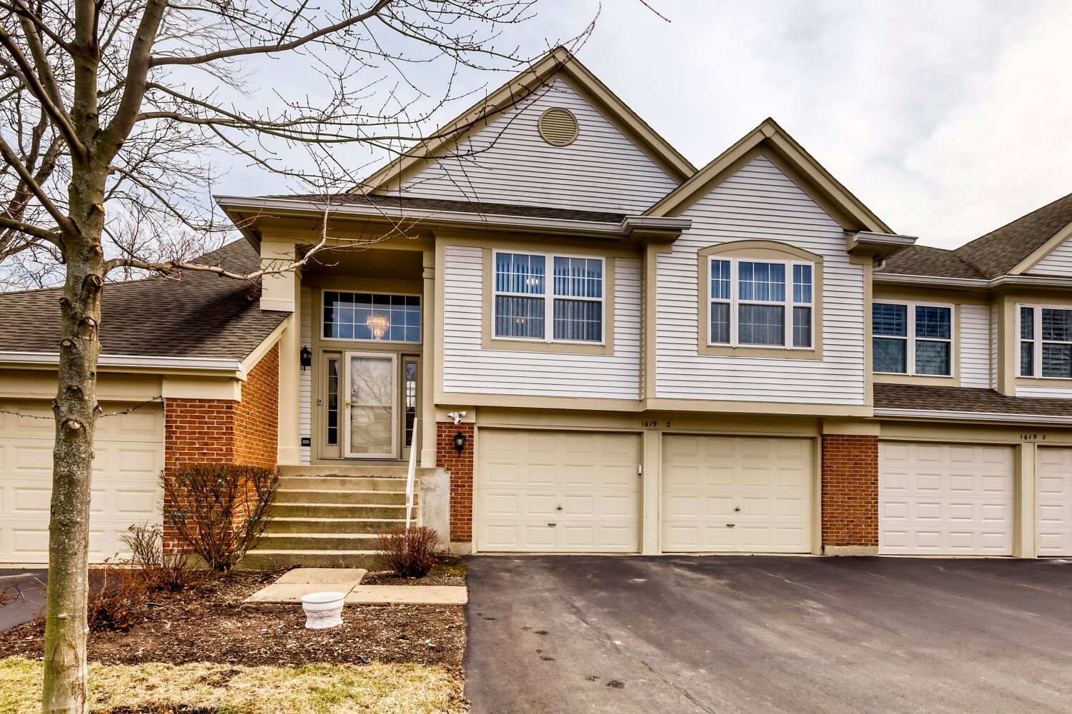 Introducing the highly sought-after Dover model, the largest townhome floor plan available, offering 2 bedrooms, 2 full bathrooms, a private balcony with relaxing views, and a spacious loft that adds valuable additional living space. Whether you need a home office, playroom, media room, or cozy retreat, this flexible area easily adapts to your lifestyle. The beautifully remodeled kitchen, completed in 2024, showcases modern finishes and flows seamlessly into the main living areas, while fresh paint and new carpet (2024) create a bright, move-in-ready feel throughout. The spacious primary suite serves as a comfortable retreat with a private full bath and generous room to unwind. Major improvements include the furnace and A/C (2020), water heater (2023), washer and dryer (2025), and a newer roof, offering lasting peace of mind. The finished garage features a sleek epoxy-coated floor and includes a 240V EV charger, while the Ring doorbell and exterior flood camera system-both included-add convenience and security. Situated on a quiet, tree-lined street, this home combines space, modern updates, and thoughtful upgrades in one exceptional package.