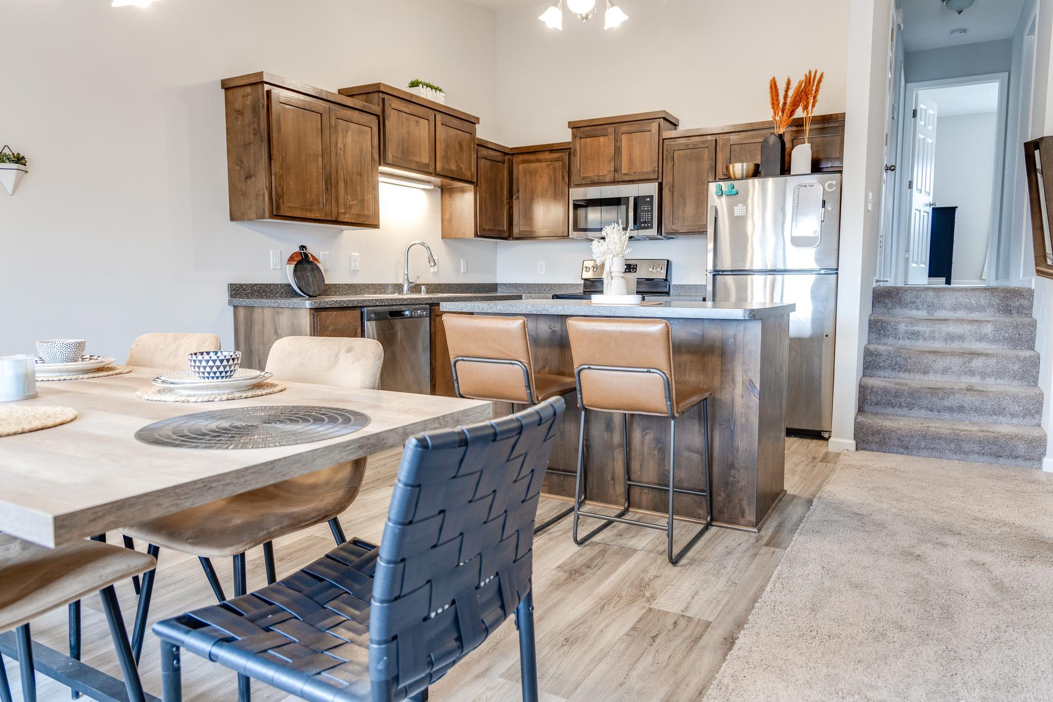 This beautiful townhouse features a comfortable layout with two huge bedrooms, spacious open concept kitchen, a walk-through full bathroom, and over 600 square feet unfinished in the Walk-Out lower level. The Kitchen boasts tons of natural light, has a large center island, high-grade cabinets, and luxuryvinyl plank flooring! Both bedrooms are spacious and feature walk-in closets. Maintenance free deckoverlooks back yard and gorgeous pond. Conveniently located just minutes from schools, shopping, golf courses, and I-94 for an easy commute.