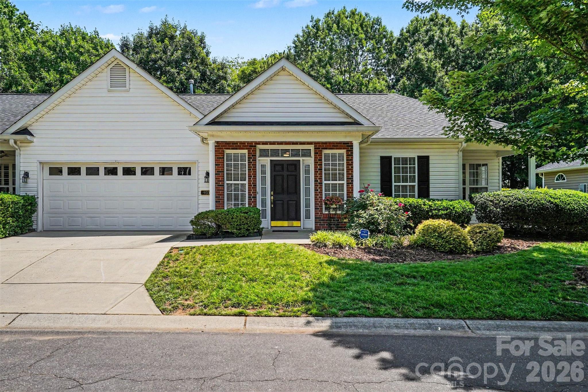 Beautifully updated single-level townhome in the highly desirable Southbrook Villas community. This inviting home features an open-concept layout with fresh interior paint, new flooring, updated lighting, and a modern kitchen complete with new quartz countertops and stainless steel appliances. The spacious primary suite provides tons of natural light and a generous sitting area or office nook.  The convenient ensuite features a double-sink vanity, and a large walk-in closet for exceptional comfort. Relax in the bright great room with a cozy gas fireplace, enjoy the oversized laundry room, and appreciate the benefits of an attached two-car garage. A private backyard adds the perfect touch of outdoor retreat. Community amenities include walking areas, pool and a clubhouse.  Dues also include trash service, water, and exterior maintenance. A truly move-in-ready home offering comfort, style, and low-maintenance living.