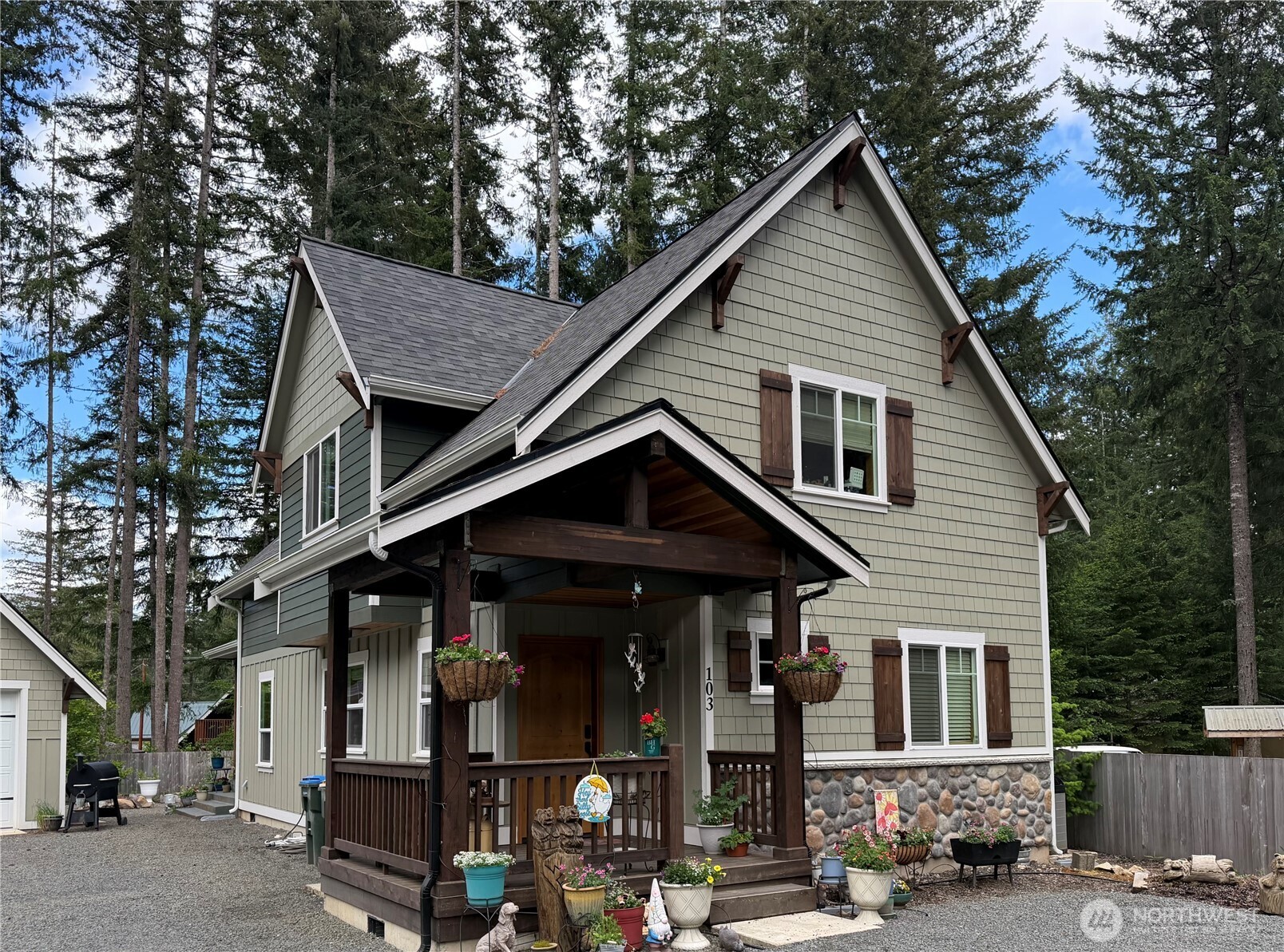 Nestled in a quiet cul-de-sac in the High Valley community, this custom-built 3 bed, 3 bath Craftsman home offers a rare blend of timeless design and Pacific Northwest serenity. Built in 2022 and surrounded by evergreens, the setting is an ideal escape.  Thoughtfully constructed by the original owner, the home showcases exceptional craftsmanship throughout, including vaulted tongue-and-groove ceilings, solid wood doors and trim, and a generous pantry. The spacious kitchen is anchored by a stunning island with quartz countertops—perfect for gathering and entertaining. A rock and beam entry welcomes you, while a classic woodstove brings warmth and character to the living space.  Outdoor living is equally considered, with a deep stamped-concrete covered deck, complete with a step-in hot tub—ideal for relaxing beneath the trees. A fully fenced yard adds privacy and function, and a fire pit creates an inviting space for evenings under the stars.  The detached garage, designed in harmony with the home’s Craftsman aesthetic, offers flexible space for vehicles or recreation. Durable cement board siding, artfully combined with shake, board-and-batten, and stone accents, ensures lasting beauty with minimal maintenance. A quality heat pump and water heater provide modern comfort and efficiency year-round.    Ideally located just minutes from White Pass Ski Area and Mount Rainier National Park, this is a rare opportunity to own a refined mountain retreat where luxury meets adventure.