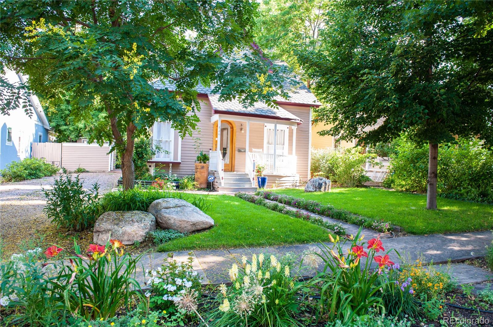 Experience the pinnacle of Boulder living in this sun-drenched Victorian sanctuary, perfectly positioned on an expansive 0.22-acre lot in the heart of iconic Mapleton Hill. Tucked behind a lush canopy of mature trees, this residence offers a rare sense of seclusion and scale just steps from the Mt. Sanitas trailhead and the world-class dining of Pearl Street. The main home radiates historic charm, featuring soaring ceilings and oversized windows that bathe the multiple living areas in natural light. The south-facing sunroom is a morning highlight, providing a serene space to sip coffee while overlooking the grounds. With 3 bedrooms and 2 bathrooms, the current layout is both comfortable and gracious, yet the deep lot offers an incredible canvas for those looking to reimagine the space with a primary main-level suite or a high-end modern addition. Adding to the property's exceptional value is a detached 1-bedroom, 1-bathroom guest house. Complete with its own private patio and an active rental license, this versatile space is perfect for an income-producing long-term rental, a high-end home office, or a private retreat for visiting guests. Rarely do you find a Mapleton Hill property that combines a private driveway, a massive backyard, and an additional legal dwelling unit. Whether you’re walking to a neighborhood cafe, hitting the trails, or exploring the vibrant downtown core, this is a once-in-a-generation opportunity to own a piece of Boulder’s most storied neighborhood.