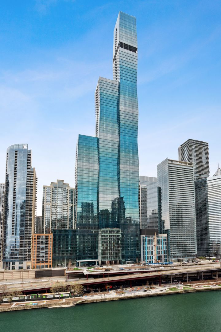 UNPARALLELED views from EVERY ROOM in this impeccably designed residence at Chicago's iconic St. Regis Residences!  Perfectly situated in the prestigious Lakeshore East neighborhood, this move-in ready home has the perfect combination of views, location and design!  Awe-inspiring PANORAMIC views of Lake Michigan, Navy Pier, the Chicago River, and city skyline from every window! This expansive, oversized condo with elevated finishes features 3 bedrooms, a custom-built glass-enclosed den/office and 2.5 bathrooms. The well-designed floor plan is perfect for everyday living or entertaining with floor-to-ceiling windows showcasing the most beautiful Chicago views, an abundance of natural light, wide plank textured oak hardwood flooring throughout and Lutron motorized window treatments. The state-of-the-art chef's kitchen offers high-end appliances and finishes, including white Snaidero cabinetry, quartz countertops, a five-burner Gaggenau gas cooktop, Gaggenau speed wall oven, built-in Gagganeu coffee maker, Thermador refrigerator and freezer-complemented by a custom-designed bar with full-sized Wine Enthusiast wine fridge, creating an entertainer's haven. A true sanctuary, the elegant and OVERSIZED primary suite features two professionally organized walk-in closets and is complete with a luxurious, spa-inspired bath that includes Gioia Venatino marble floors, quartz countertops and full-height stone walls, Kallista plumbing fixtures, Robern medicine cabinets, dual vanity, separate standing shower and soaking tub. Two additional spacious bedrooms offer breathtaking views and share a remarkably spacious bathroom with dual vanity down the hall.  The masterfully designed powder room will impress all guests. Resident-only amenities located on the 47th-floor Sky Terrace include an outdoor pool adjoined by a hot tub, fire pit, and resident lounge. Fitness and training rooms, steam room, sauna, conference center, private dining room, wine tasting room with wine storage, golf simulator, and children's playroom are located on the same floor. Incredible Lakeshore East location with easy access to the lakefront, Riverwalk, Michigan Ave, public transportation, Millennium Park, museums, restaurants, the theatre district, shopping, Maggie Daley Park, Lakeshore East Park and Mariano's grocery store just steps away. The St. Regis Chicago is making their mark on the city with the newly opened high rated restaurants - Tre Dita and Miru. Residents also have access to all the St. Regis 5-star amenities including spa, gym and indoor pool. This is luxury living at its finest! 1 Valet parking spot included in price.