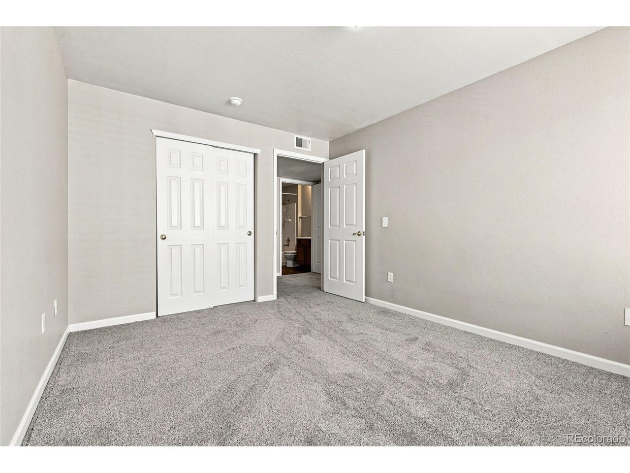 Updated condo in desirable Pinnacle Ranch, with rare 3 bedroom/2 bath layout! Move-in ready with fresh paint and new flooring throughout (vinyl plank in living areas and carpet in bedrooms). The main living area is sunny yet cozy, with an open layout between kitchen, dining and living rooms, a corner fireplace, and patio. The kitchen features plenty of cabinet and newer appliances. Bedroom layout is fantastic - relax in the large primary suite, with walk-in closet and full bath. Two other good sized bedrooms share a second bath, perfect for guests, family, roommates. New furnace and AC within last 2 years; newer hot water heater. Washer and dryer included in unit. Parking space #137. Residents enjoy a range of community amenities, including a pool, clubhouse, and playground, all within a professionally managed, gated community. The property is conveniently located near public transportation and offers easy access to Cherry Creek, Lowry, Anschutz Medical Campus, Downtown Denver, and major commuter routes. With shopping, dining, parks, and everyday essentials just minutes away, this top-floor home offers an exceptional opportunity for homeowners or investors seeking comfort, value, and a well-maintained property in a convenient central location. Cherry Creek schools!