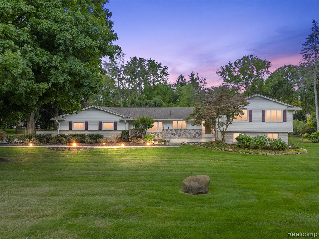 Welcome home to this wonderful opportunity to live in Lone Pine Road Estates and enjoy all the amenities this incredibly sought-after area has to offer. In Bloomfield Hills, with pristine Gilbert Lake privileges, 951 Timberlake is a true oasis with an “Up North” feel. Surrounded by Natural Beauty; enjoy peaceful walks through the neighborhood as well sunrises, sunsets and stargazing from the private beach lot. 
Nestled in the heart of the neighborhood, this sprawling 4 bed 3.1 bath quad-level features superb craftsmanship at every turn. A substantial family room and additional living room, newer mechanicals, multiple fireplaces, and fenced-in yard are a few of the perks. Flooded with natural light, the open layout is perfect for entertaining, relaxing and enjoying everyday life! Repaint, remodel or rebuild to make it your oasis, too. Situated on an idyllic 1.36 acre lot, this home is ready for its next owners.