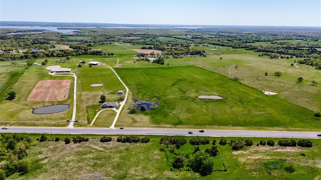 Your dream home or ranch retreat awaits on this beautiful 30-acre property with prime frontage along US Highway 377. Level to gently sloping terrain makes it ideal for building, ranching, or recreational use, and the tract includes a peaceful pond and open pasture currently used for hay production.

Located in the desirable Gordonville area, this land offers the rare combination of country serenity and exceptional convenience. You’re just minutes from Lake Texoma—one of the largest reservoirs in the United States with over 500 miles of shoreline and endless opportunities for boating, fishing, and lakeside adventure. Rock Creek Resort and its Arnold Palmer–designed golf course are less than 5 miles away, and nearby marinas include Walnut Creek, Cedar Mills, and Buncombe Creek.

Enjoy easy access to Gainesville, Sherman, and Denison for shopping, dining, and healthcare, or head a bit farther to the casinos and entertainment in Durant, Oklahoma. The surrounding area is rich in recreation with local golf clubs, campgrounds, and public landing strips for private pilots.

Whether you envision a custom home, weekend getaway, or small ranch, this property provides the perfect blank canvas for your North Texas lifestyle—just off the highway, close to everything, and surrounded by natural beauty.