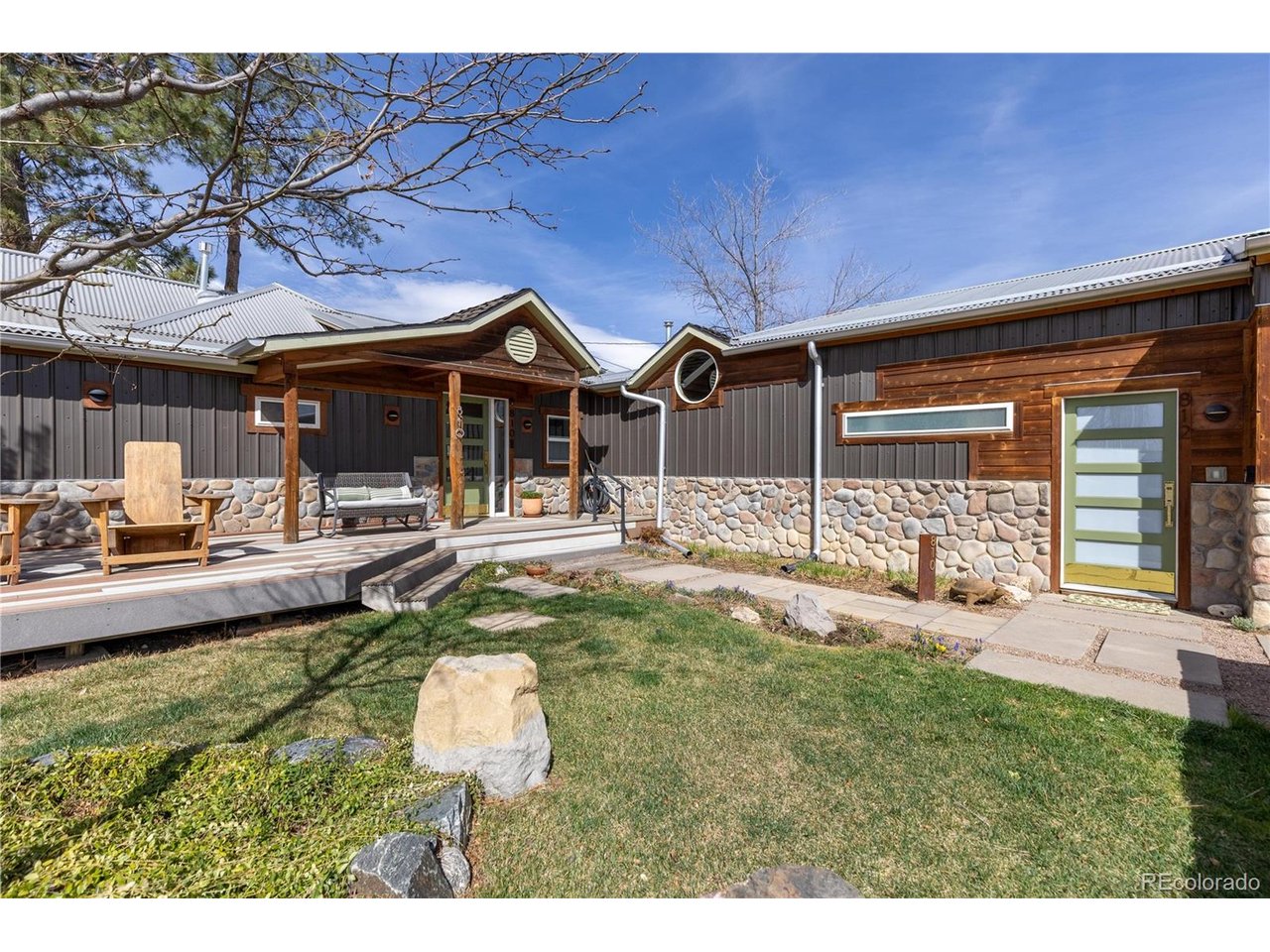 Incredibly rare and truly one-of-a-kind, this exceptional ranch property in the heart of Loveland offers a unique blend of rustic charm and modern sophistication-complete with a private attached ADU. Situated on one lot, yet each with its own outdoor space, the property features the main residence (810 Taylor Ave) and a beautifully designed ADU (812 Taylor Ave), creating a rare opportunity for investors or owner-occupants seeking flexibility, income potential, or multi-generational living.Thoughtfully crafted with top-tier materials and impeccable workmanship, both homes showcase custom finishes and distinctive design elements throughout. Warm wood panel accent walls and ceilings, rich hickory and oak flooring, and handcrafted details create a welcoming yet elevated aesthetic. The main home is filled with character, including an antique soaking tub in the primary suite, a whimsical lighted hideaway loft with rolling ladder, and solid wood custom interior doors paired with elegant brass and copper hardware.The attached ADU offers privacy and versatility, complete with its own fenced courtyard-perfect as a rental, guest retreat, or private living quarters. Recent updates enhance comfort and efficiency, including a new furnace and central A/C, EV charging station, gas fireplace, updated gas cooktop, new refrigerator, custom laundry room with front-loading washer/dryer, fresh interior paint, insulated and lined crawl space, new gutters, and south-facing windows replaced in 2025.Outside, enjoy stunning curb appeal with newly planted flowering trees and an oversized garage with ample storage. Ideally located less than a mile from downtown Loveland's charming shops, restaurants, and only 2 miles from Boyd Lake State Park, and easy access to Rocky Mountain National Park via highway 34. This extraordinary property offers a lifestyle opportunity that is as rare as it is remarkable.