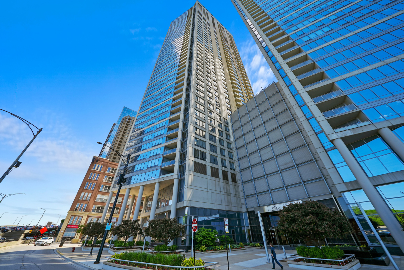 Experience Spectacular Lakefront Living at 600 N. Lake Shore Drive    Discover over 2,500 sq. ft. of unobstructed lake views from this stunning 11th-floor northeast corner residence-the largest three-bedroom layout in the prestigious north tower at 600 Lake Shore Drive in Streeterville. As you step inside, you're immediately greeted by breathtaking, sweeping views of Lake Michigan from every window. This highly sought-after split-bedroom floor plan offers the perfect balance of formal and informal living with abundant space and flexibility. The Chef's kitchen features granite countertops, a custom backsplash, upgraded stainless steel appliances, and ample cabinetry. The oversized breakfast bar comfortably seats five, complemented by custom overhead lighting, making it an ideal space for entertaining. Cooking with such spectacular views is a game-changer! The open-concept living, dining, and kitchen areas flow effortlessly onto a large inset balcony, perfect for enjoying evening cocktails while soaking in the incredible scenery. Adjacent to the main living space, a bonus area overlooks the lake and provides additional seating, complete with a dry bar and beverage refrigerator for effortless entertaining. The luxurious primary suite is a haven of comfort, offering lake views, plush custom carpeting, and two spacious walk-in closets with custom built-ins. The spa-inspired ensuite bath features double marble vanities, a whirlpool tub, and a separate steam shower for a true retreat experience. The second bedroom offers stunning north-facing views, custom carpeting, a custom walk-in closet, and private balcony access. The third bedroom, with its serene lake views, is currently configured as a home office but easily accommodates a queen bed and dresser. It includes an ensuite bathroom, making it perfect for guests. Additional highlights include a conveniently located powder room for guests, a spacious laundry room with a full-size washer and dryer, and extra storage space. One prime third-floor parking spot is available for $50,000, and the residence includes a full-cage storage unit.    600 N. Lake Shore Drive is a full-amenity LUXURY building featuring a beautifully designed lobby, 24-hour attentive door staff, on-site management, and an updated fitness center with state-of-the-art equipment. The building also offers two rooftop lounges and party rooms with panoramic views of the lake and city skyline. Situated in a quiet, premier Streeterville location, you're just steps away from Ohio Street Beach, the Lakefront Trail, Navy Pier, Michigan Avenue, and some of Chicago's finest dining and shopping destinations. Watch the annual Air and Water Show from your private balcony or enjoy fireworks every Monday and Wednesday during the summer months. Don't miss this rare opportunity to live in one of Streeterville's most coveted buildings. A dream home with unmatched value, this residence offers the ultimate in lakefront living. Explore the property in 3D! Click the 3D button to take a virtual tour and walk through every detail.
